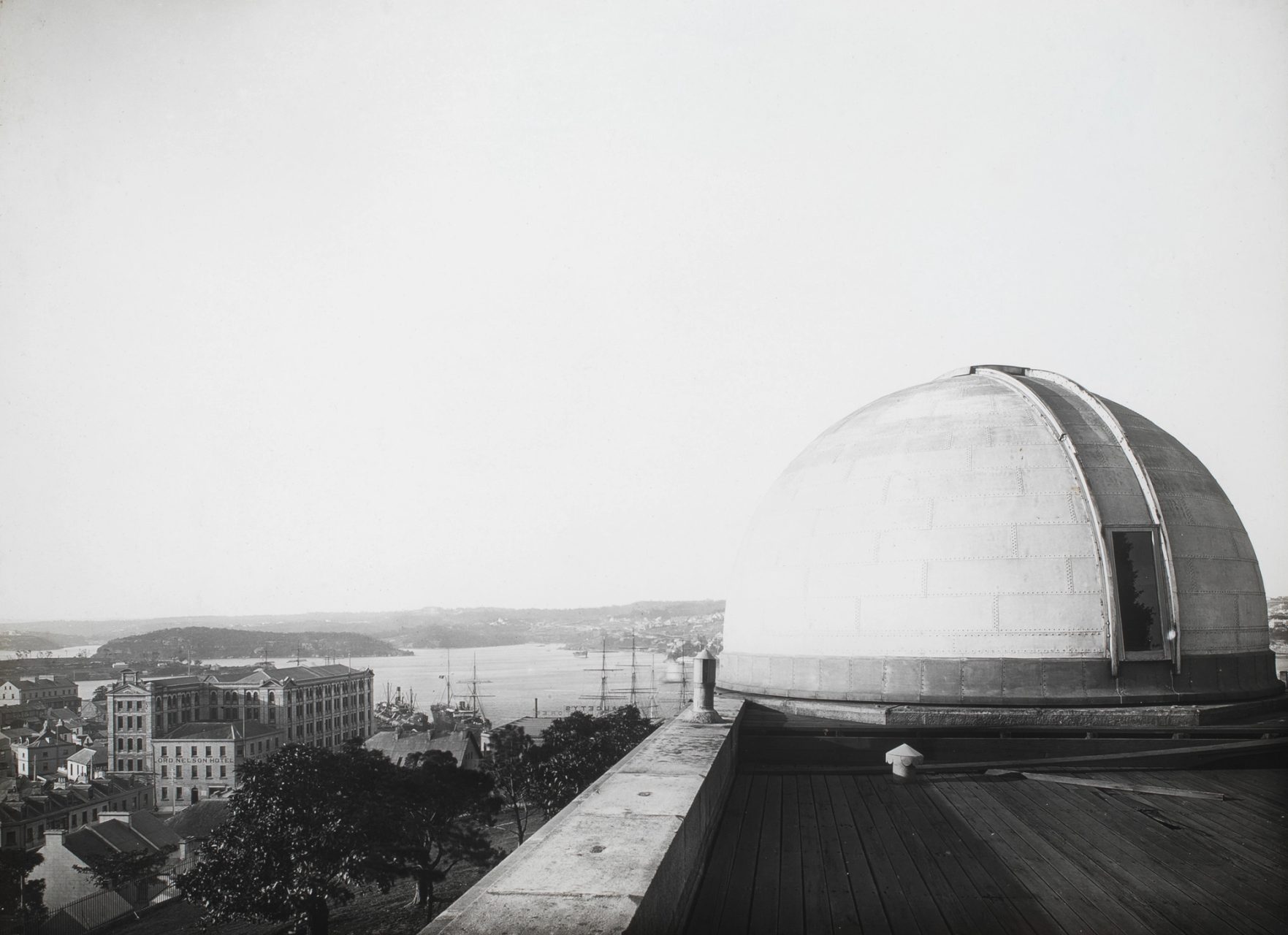 Observatory’s dome in the foreground right, and a view of Sydney Harbour to the rear