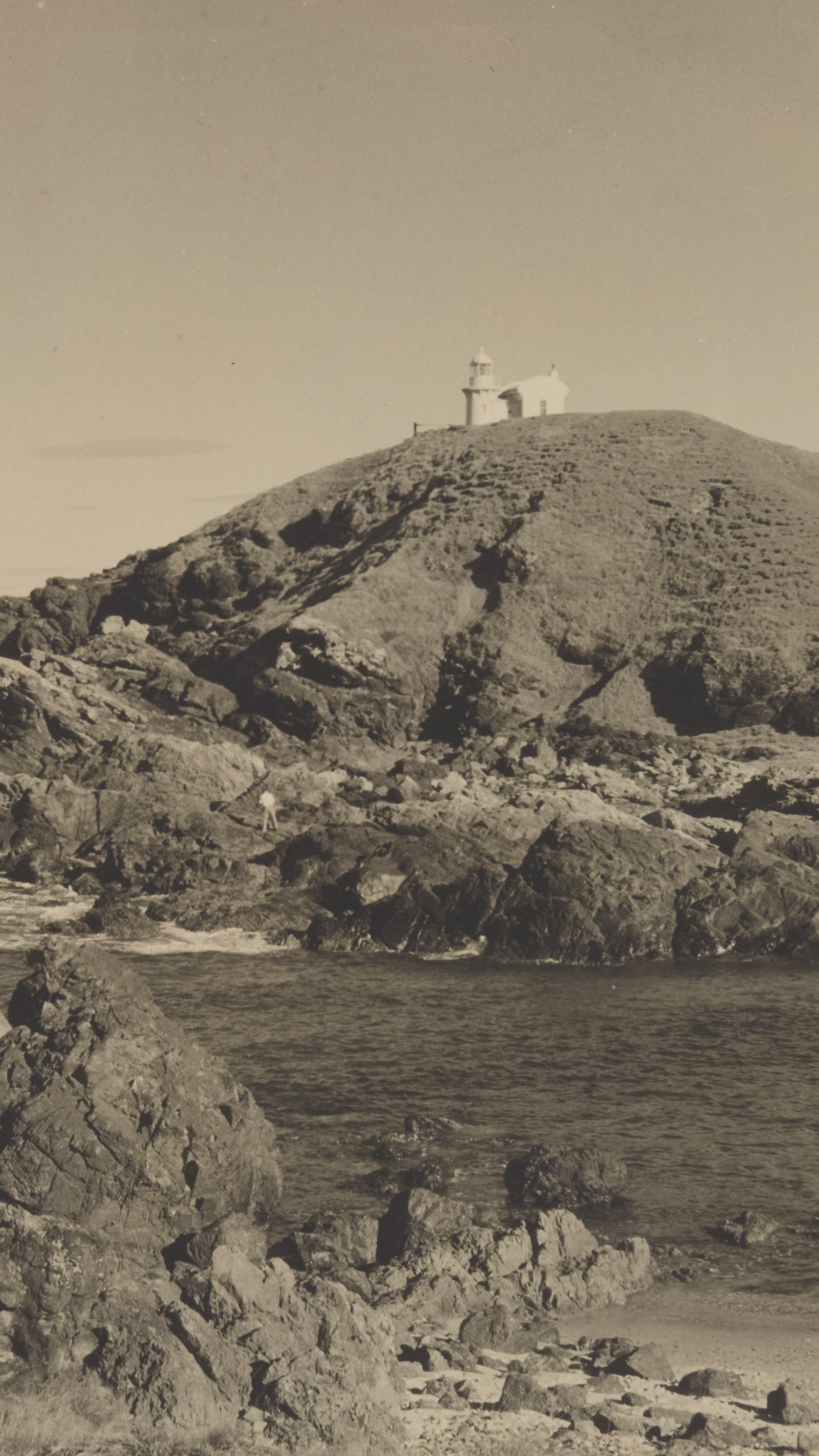Coastal scene with a lighthouse.