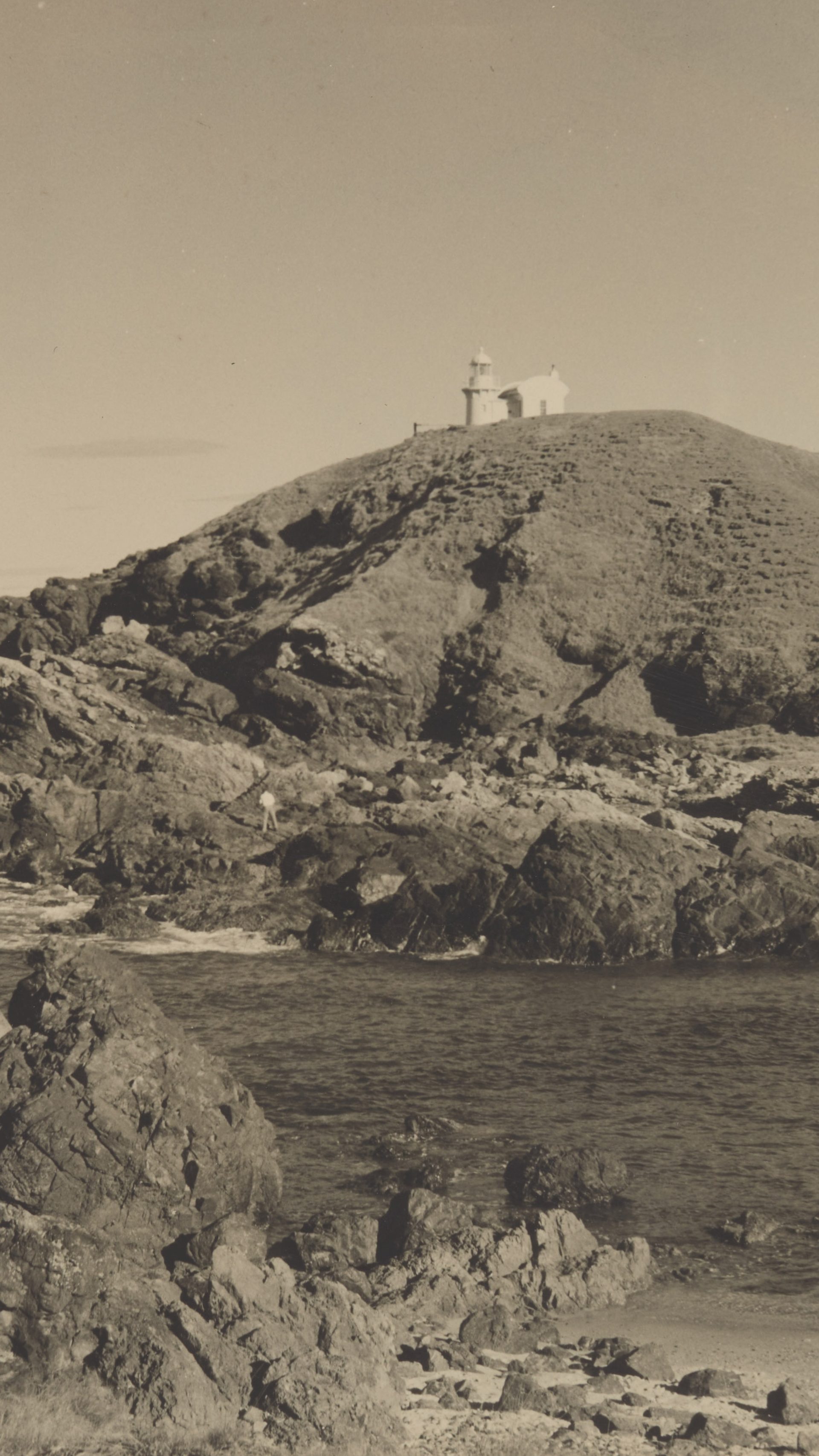 Coastal scene with a lighthouse.