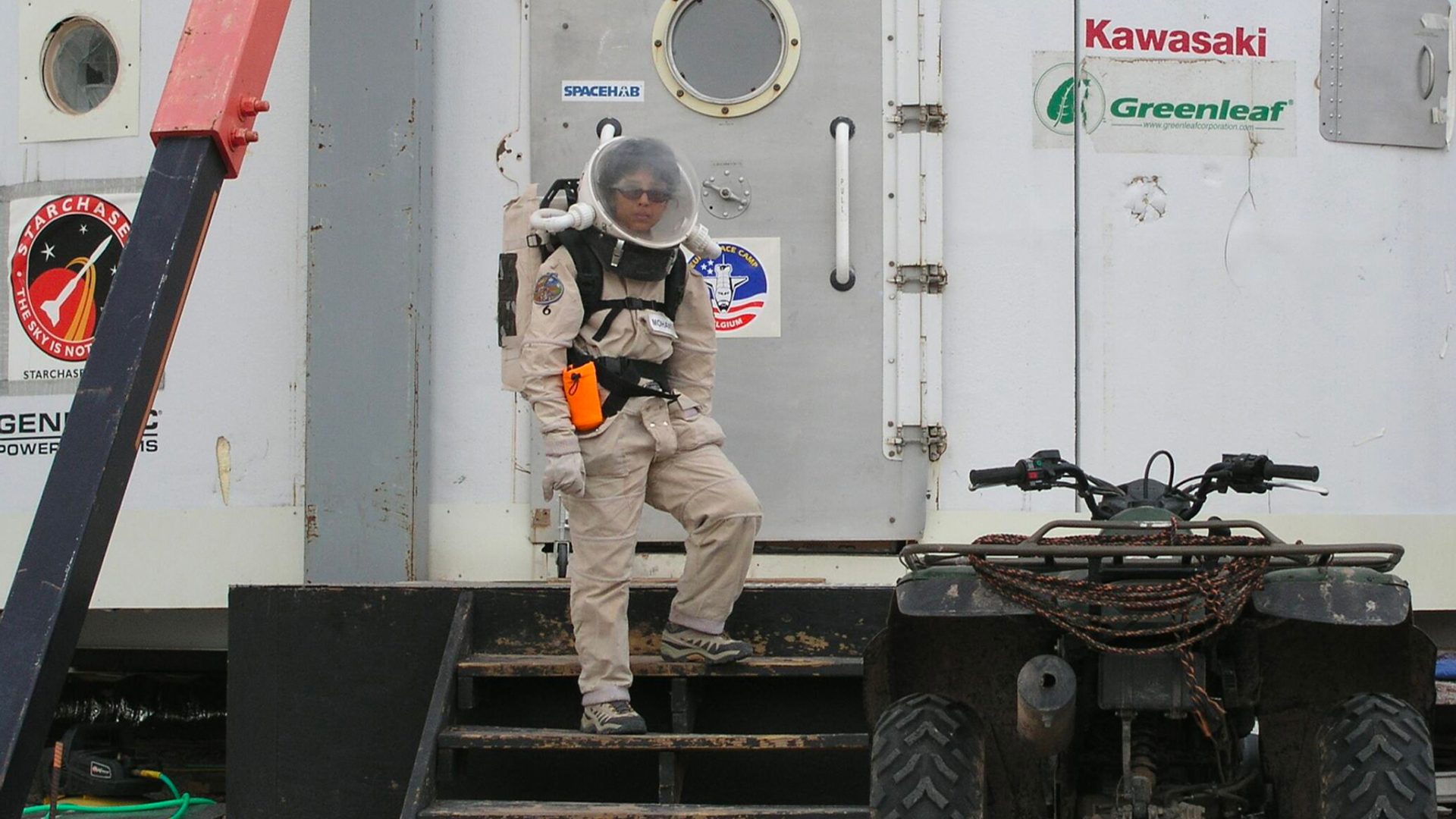 Woman standing on space station.