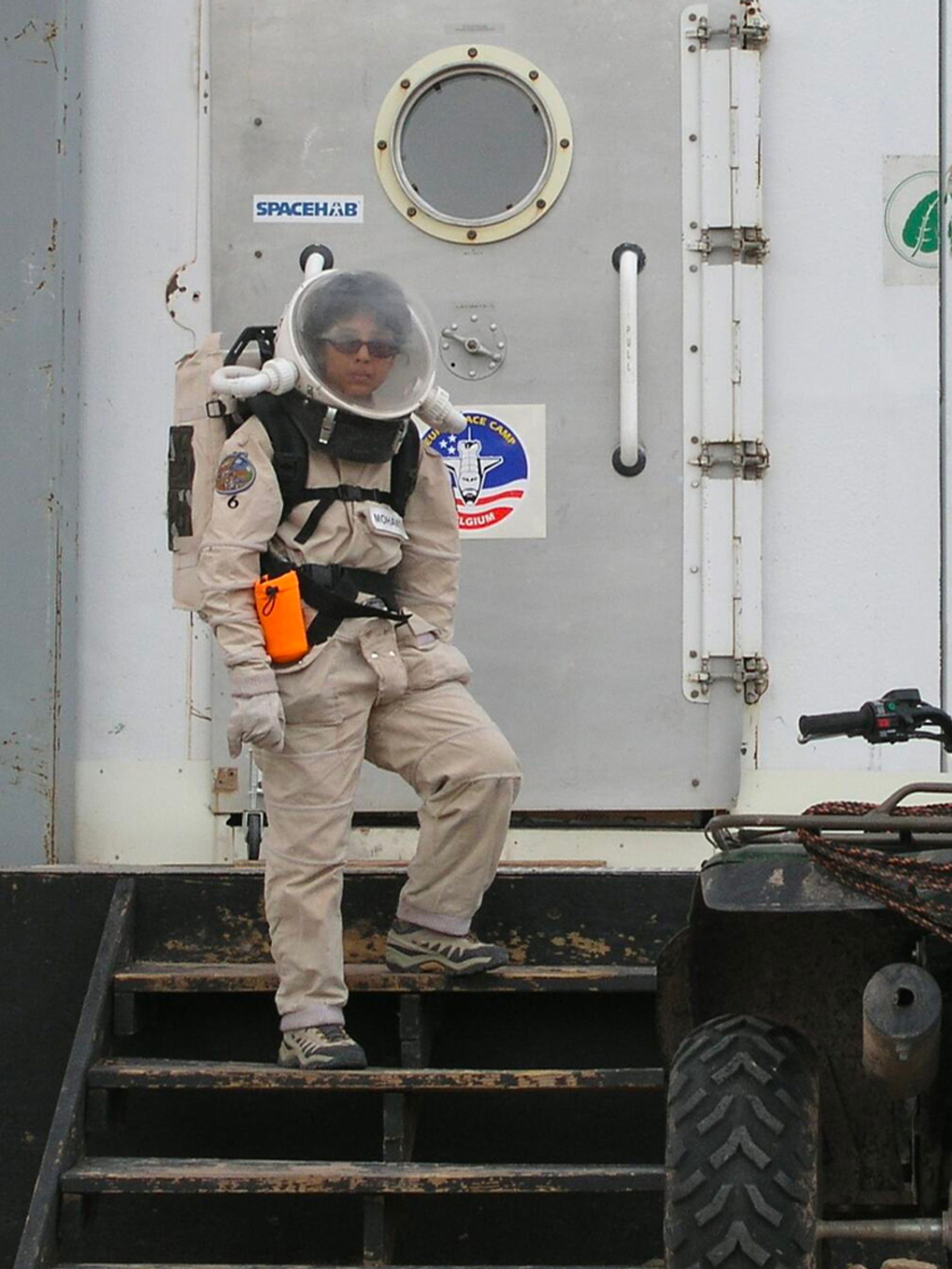 Woman standing on space station.