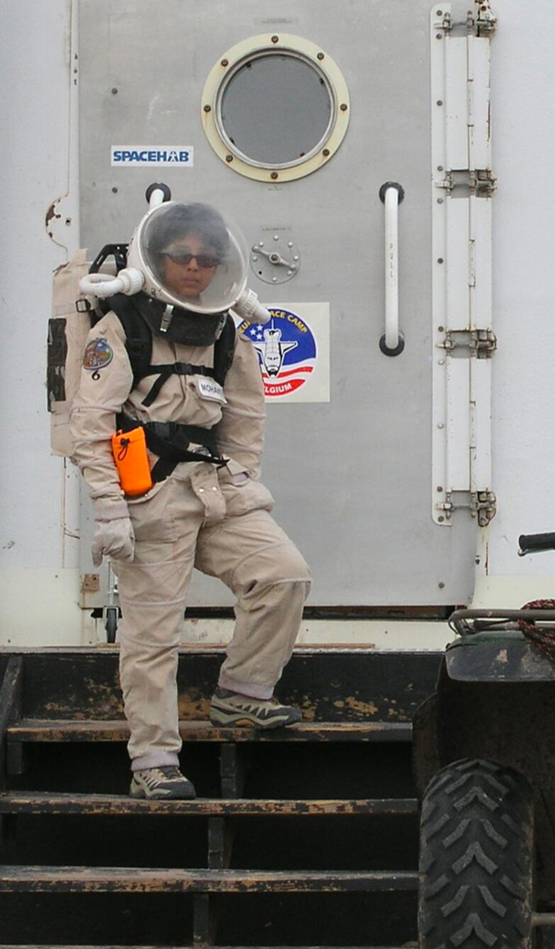 Woman standing on space station.
