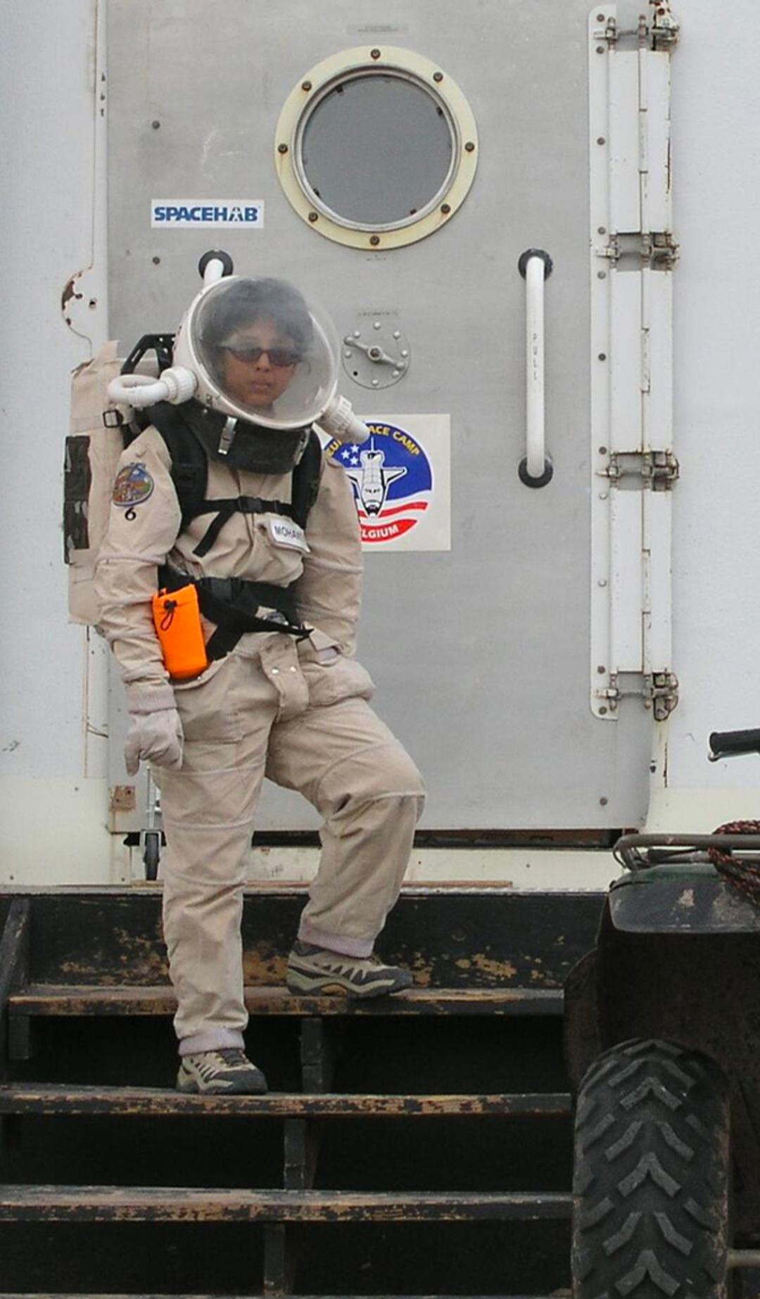 Woman standing on space station.
