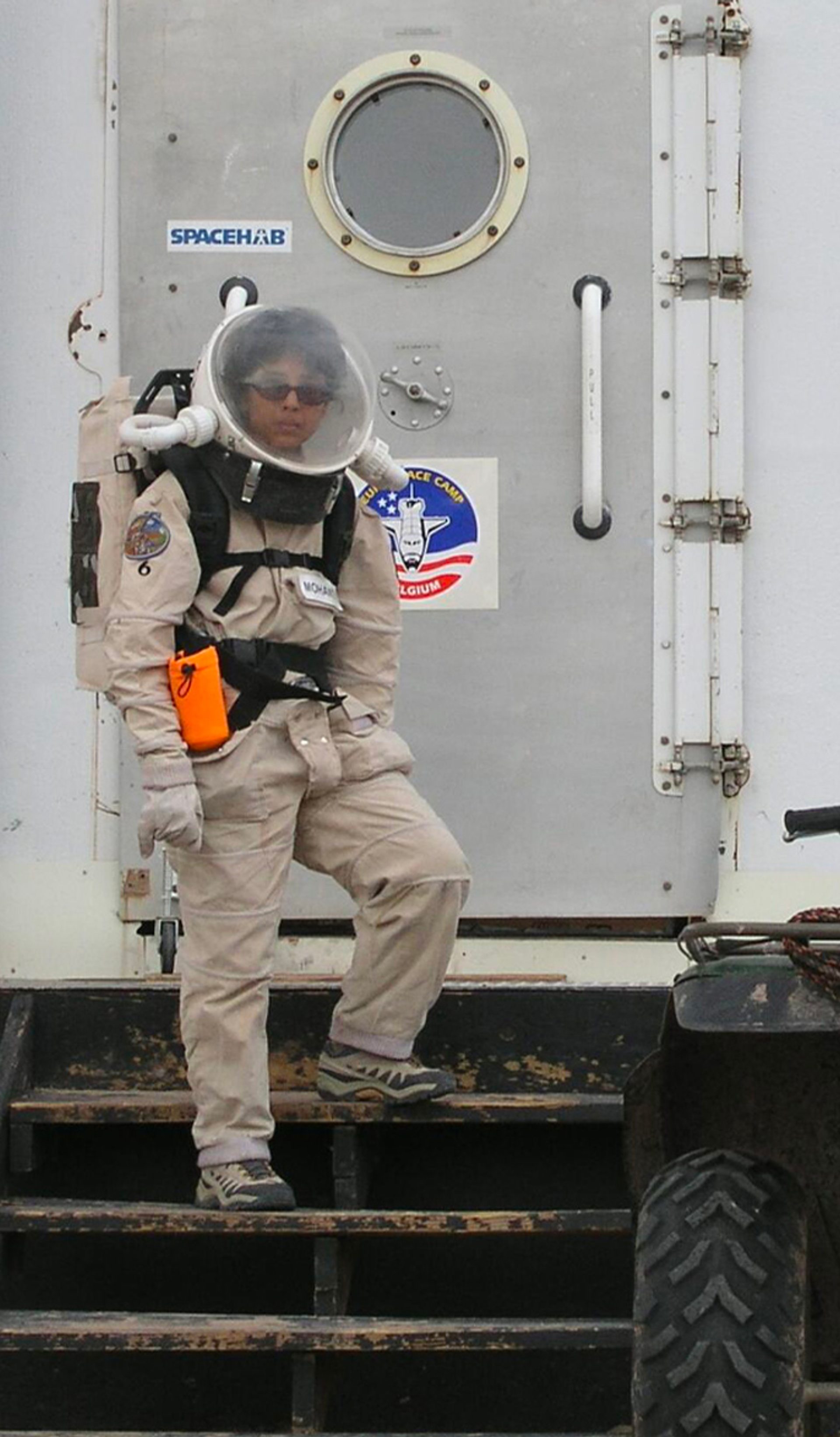 Woman standing on space station.