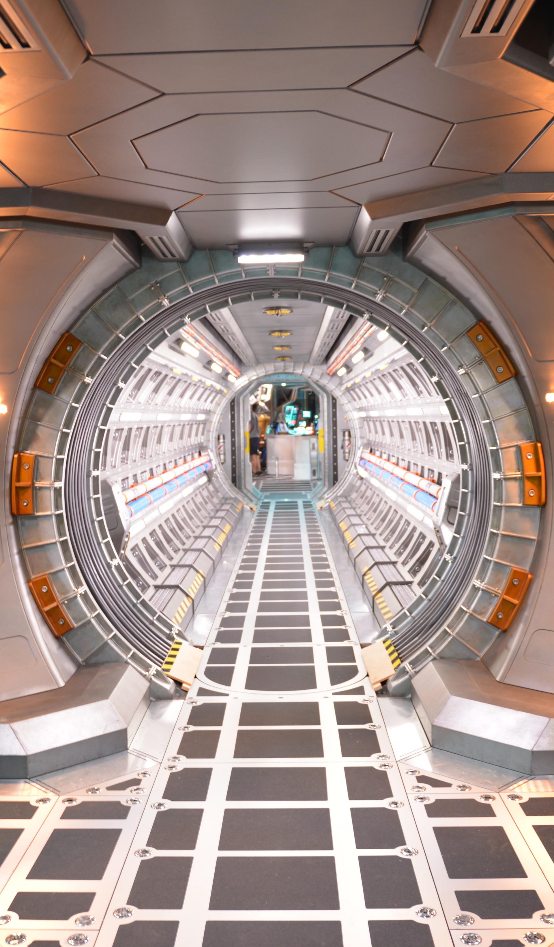 A film set depicting silver corridors from the interior of a spacecraft.