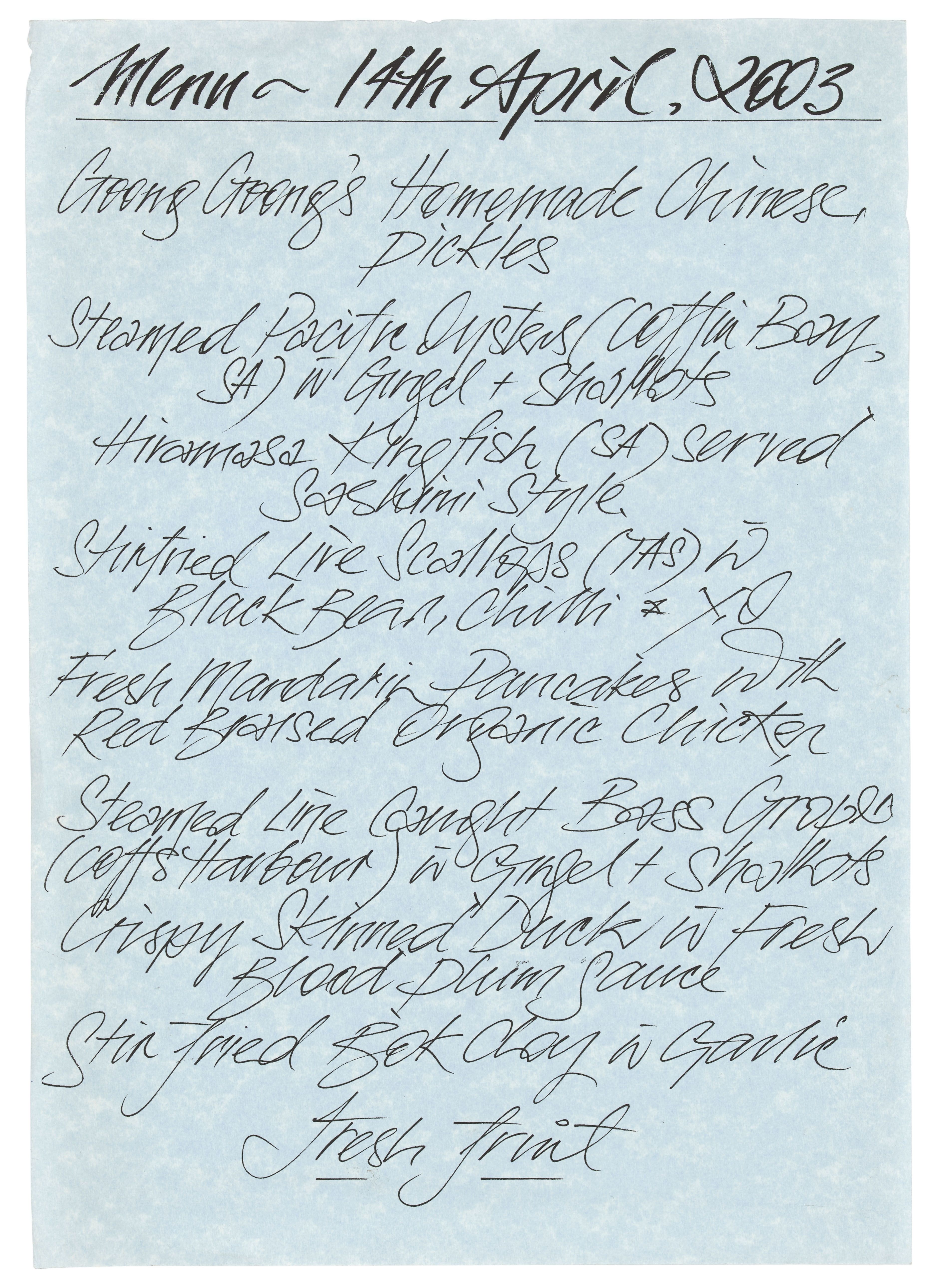 Blue paper with handwritten menu atop it.