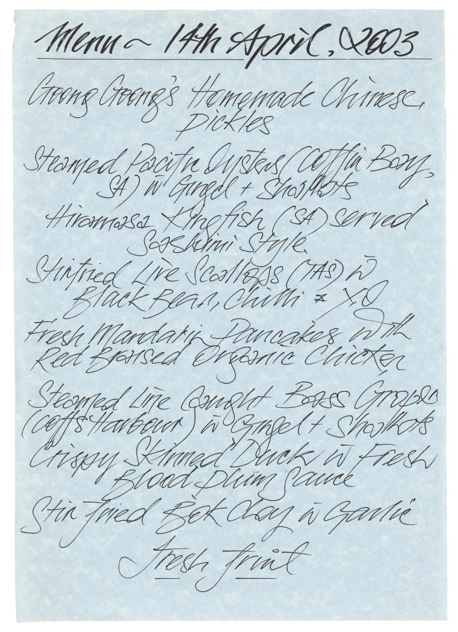 Blue paper with handwritten menu atop it.