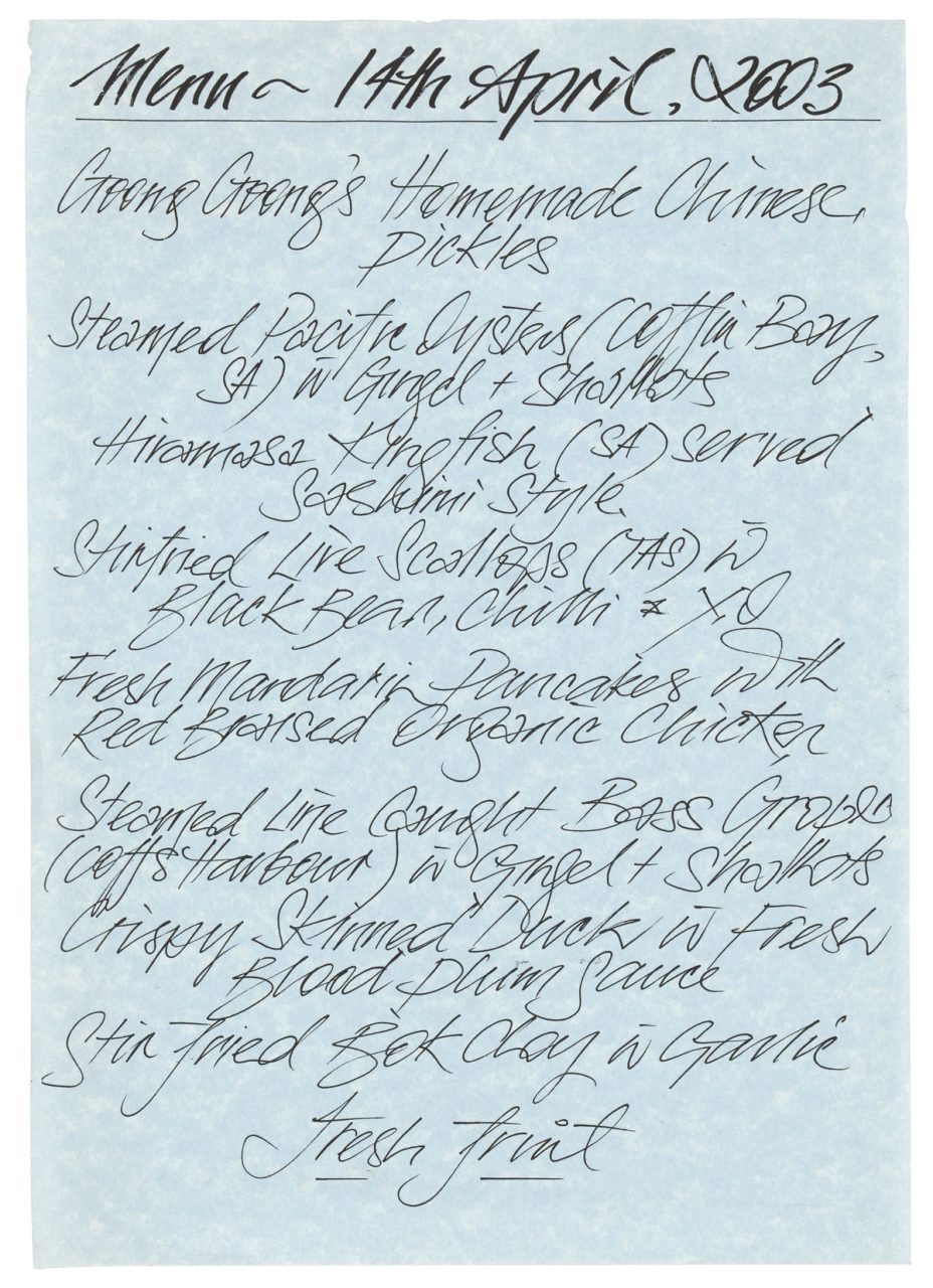 Blue paper with handwritten menu atop it.