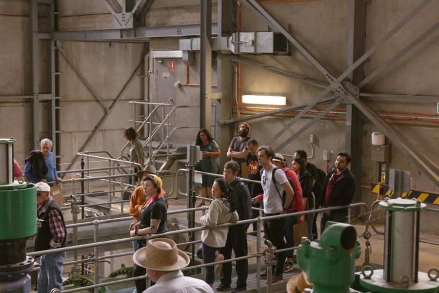 Tour group standing inside the dam infrastructure