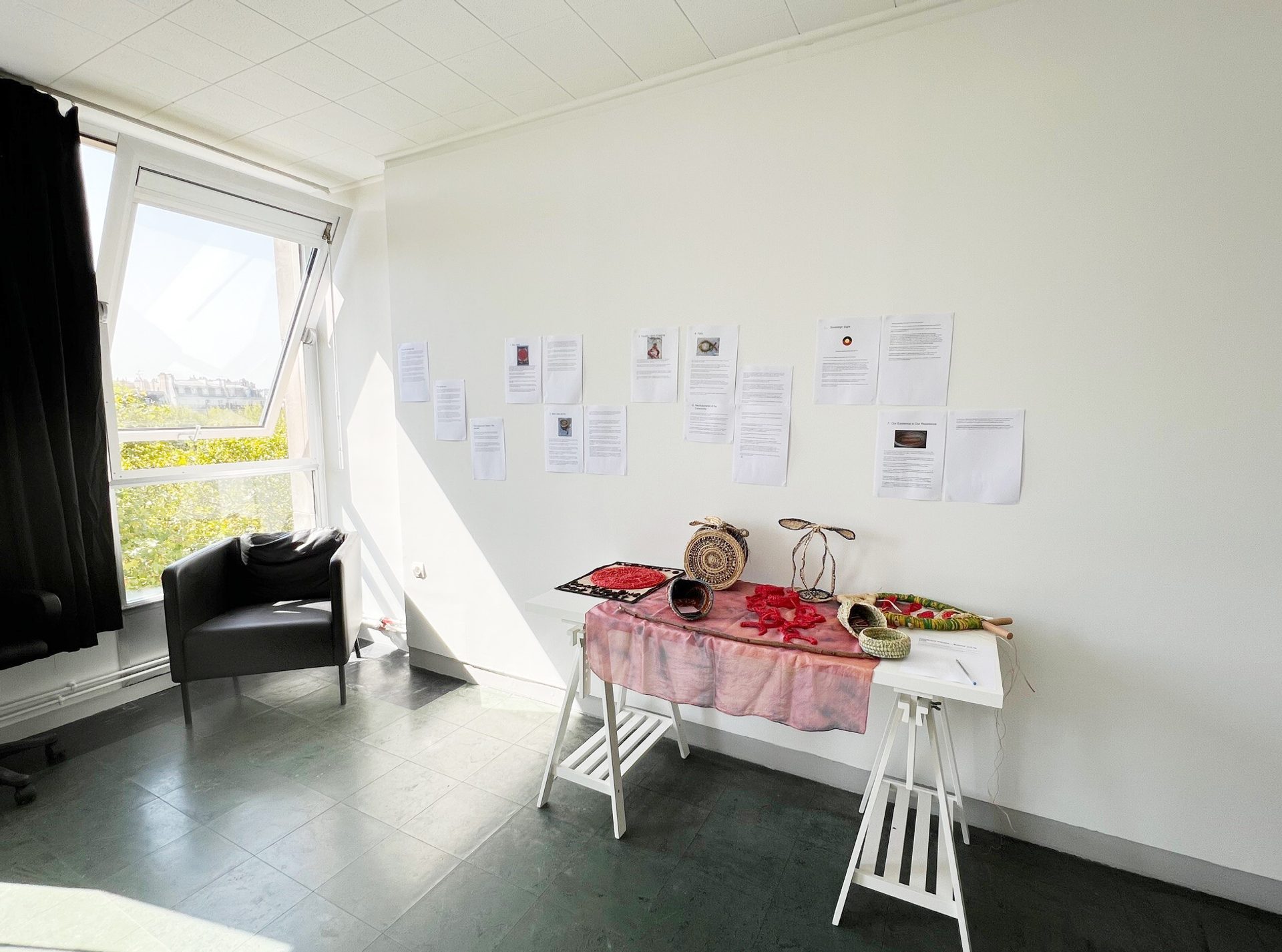 A studio room, with white walls and a window.