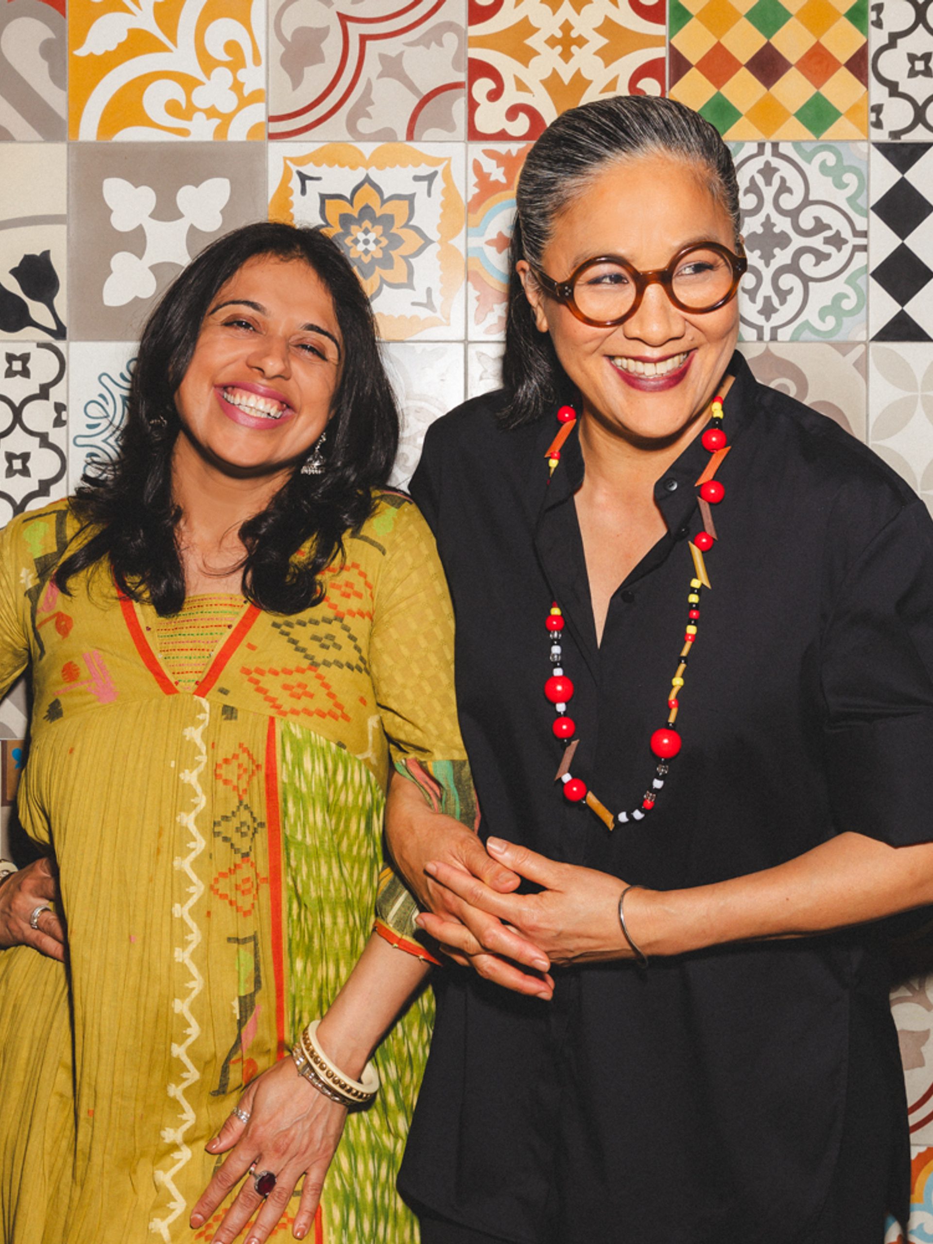 Two figures smiling for the camera.