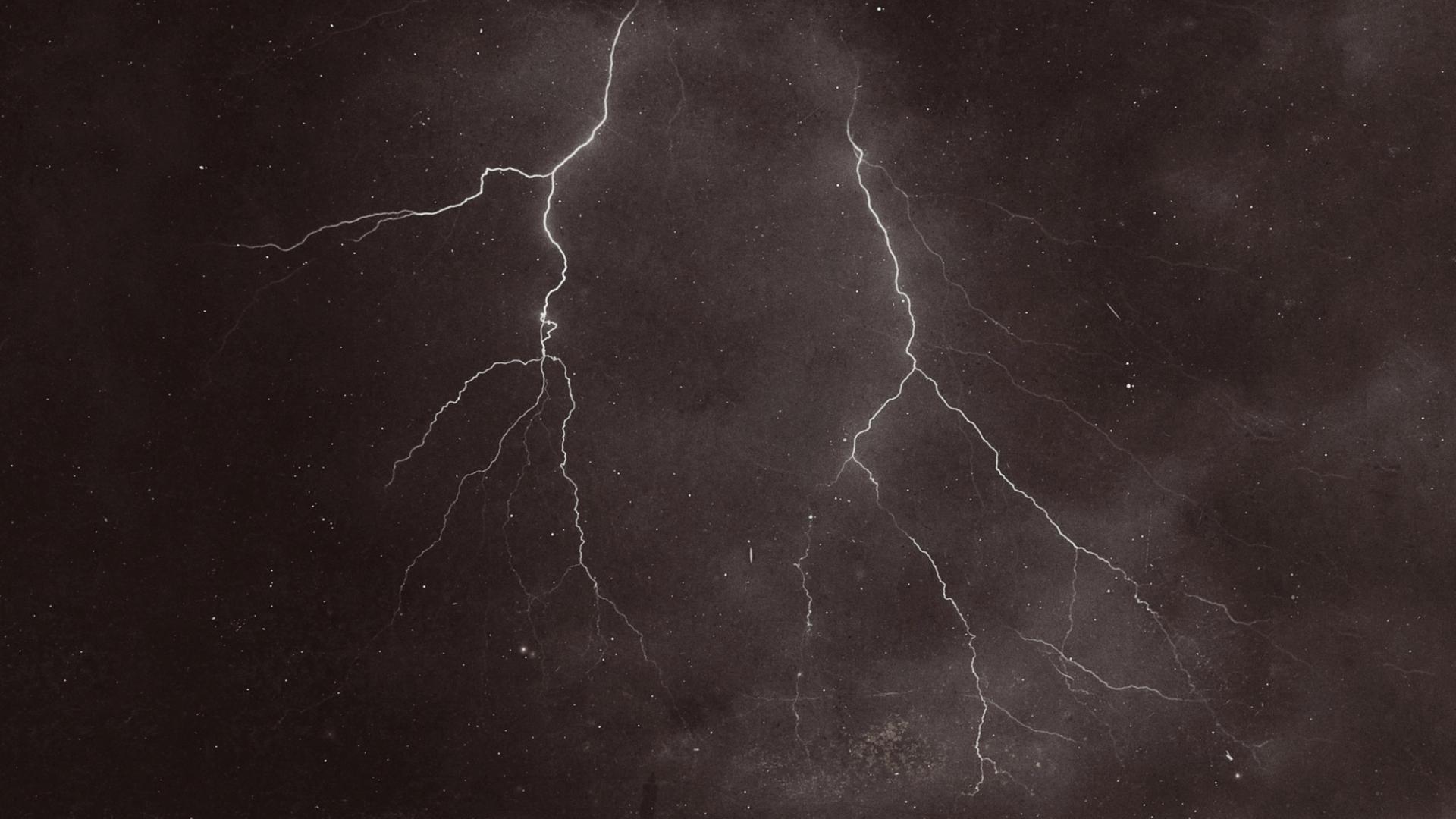 two lightning bolts in the night sky