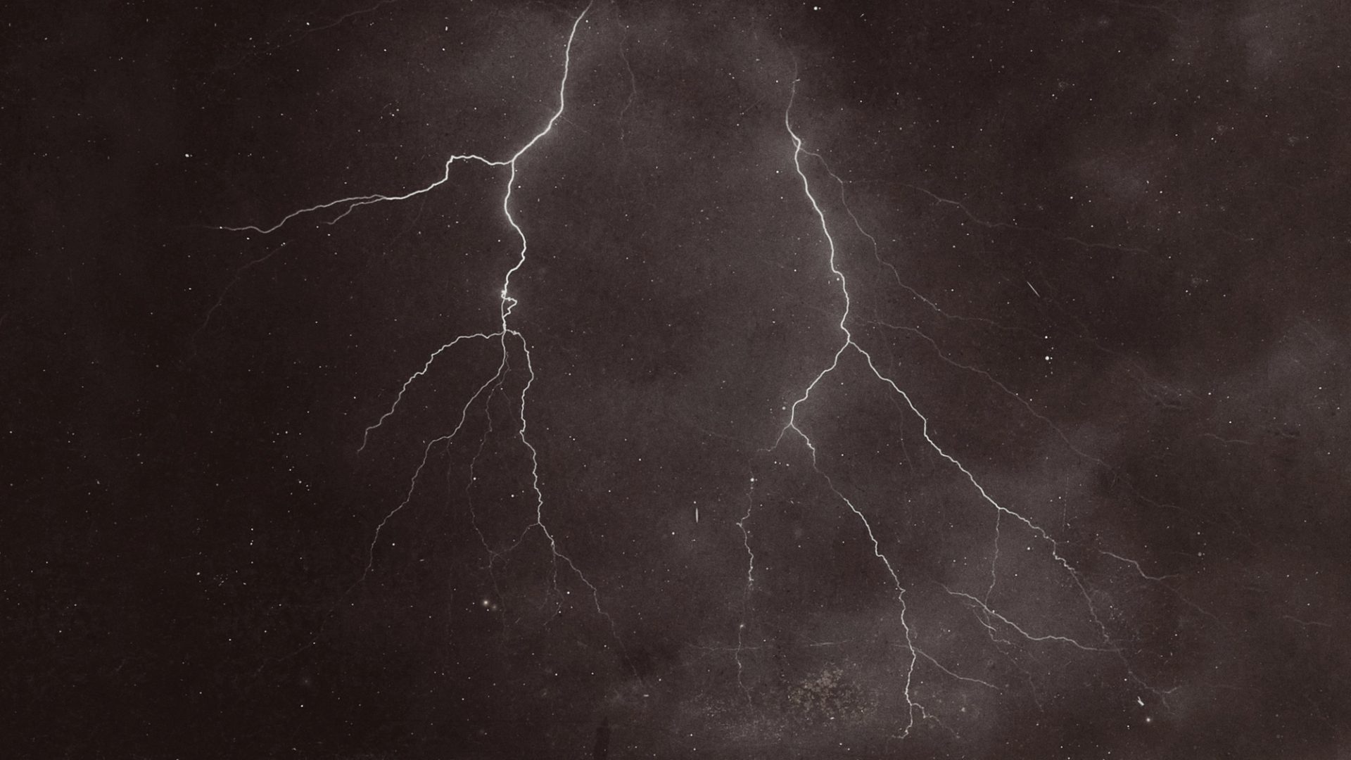 two lightning bolts in the night sky