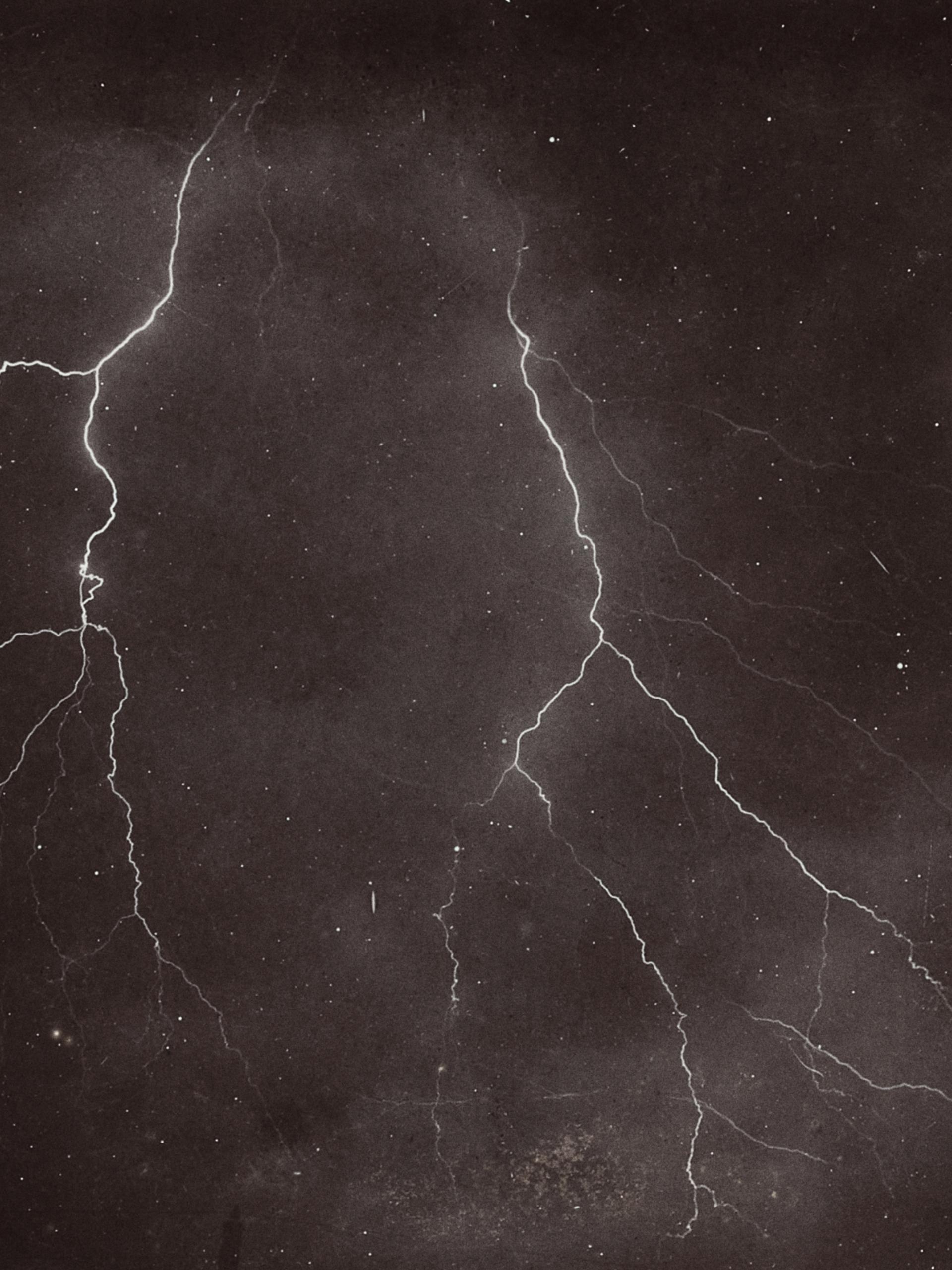 two lightning bolts in the night sky