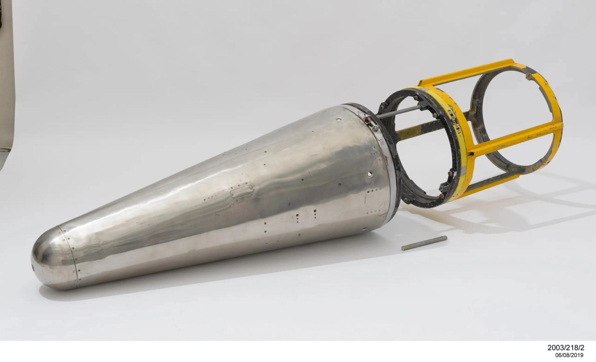 Polished stainless-steel conical nosecone, identified as being from a Skylark rocket. The nosecone has a more hemispherical nose than that on the associated complete Skylark.