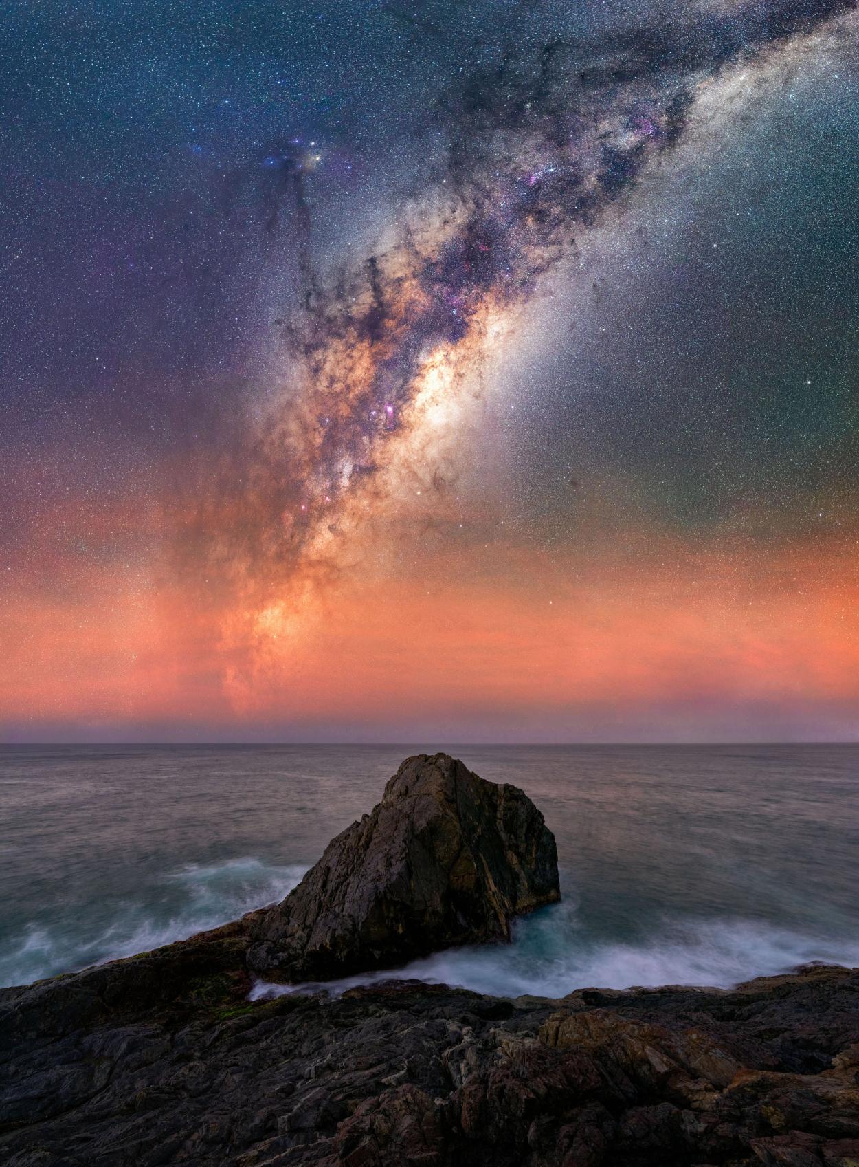 Stars arching atop the ocean