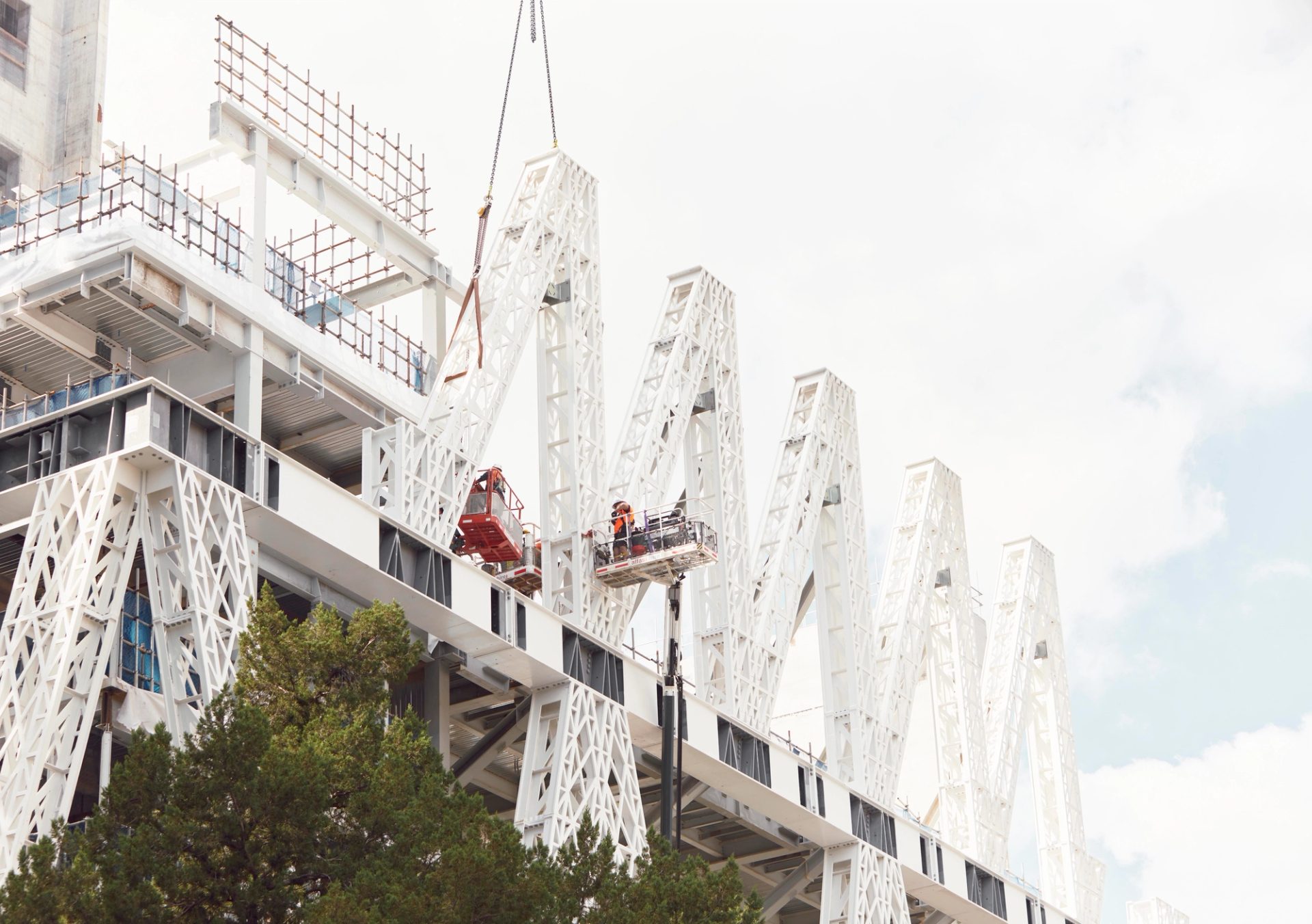 Ground view of building under construction.