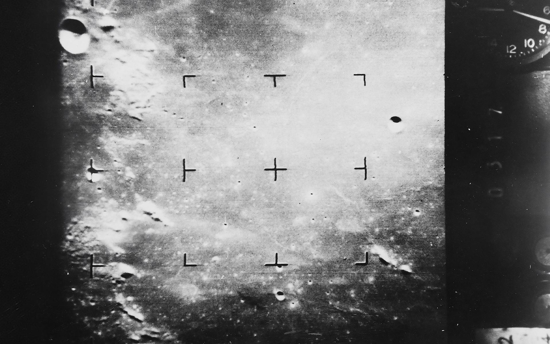 Photograph showing the moon’s surface taken in black and white.