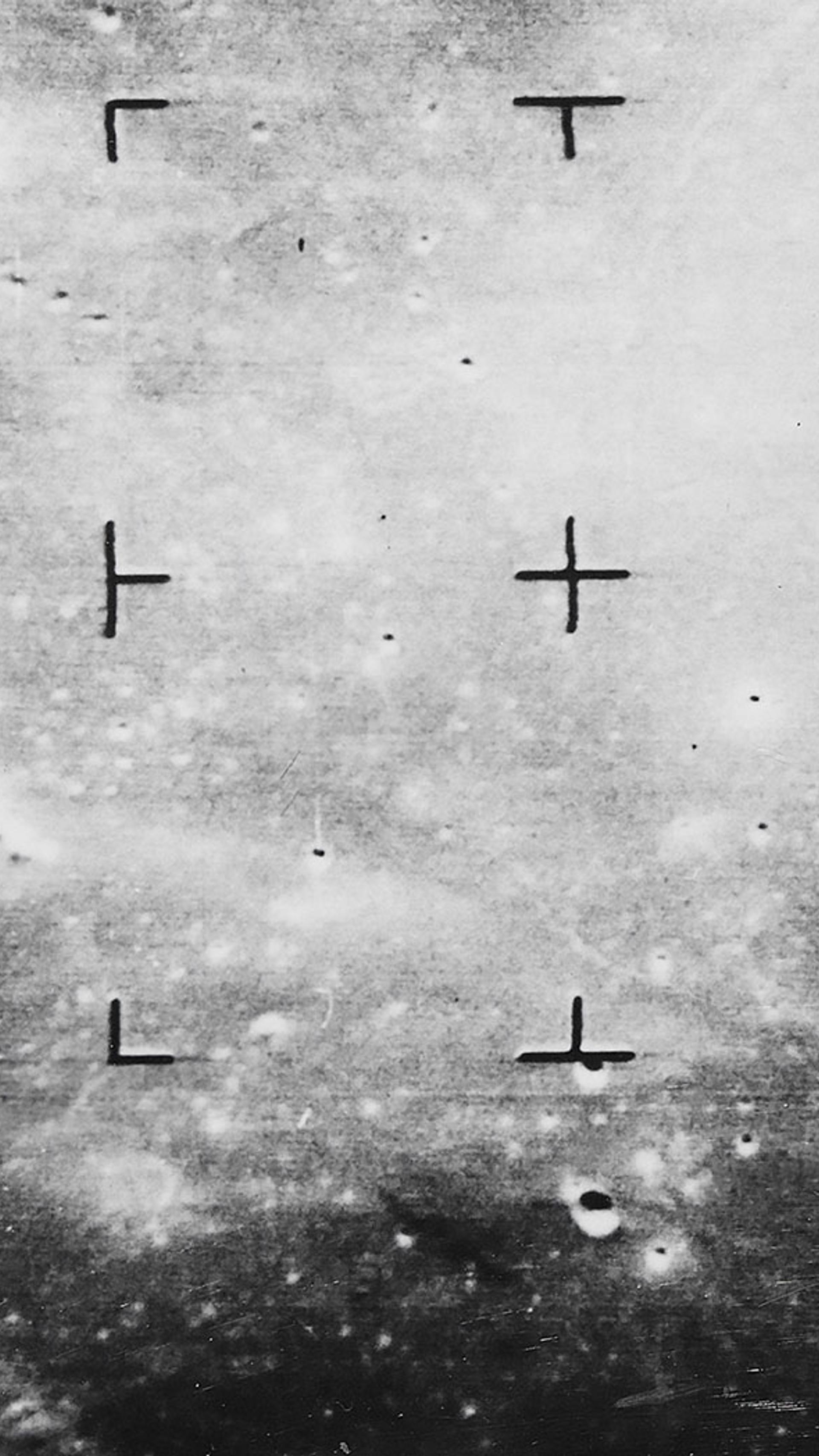 Photograph showing the moon’s surface taken in black and white.