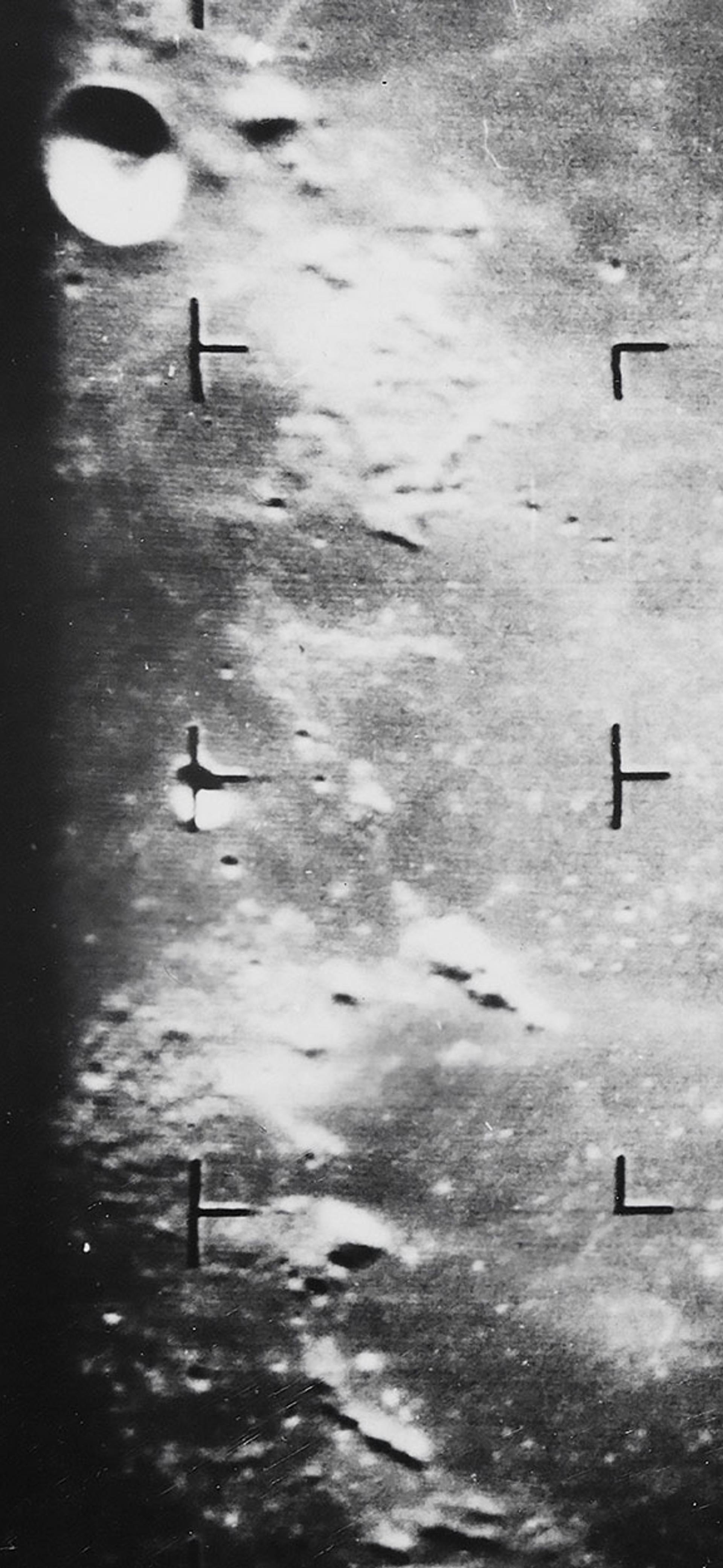 Photograph showing the moon’s surface taken in black and white.
