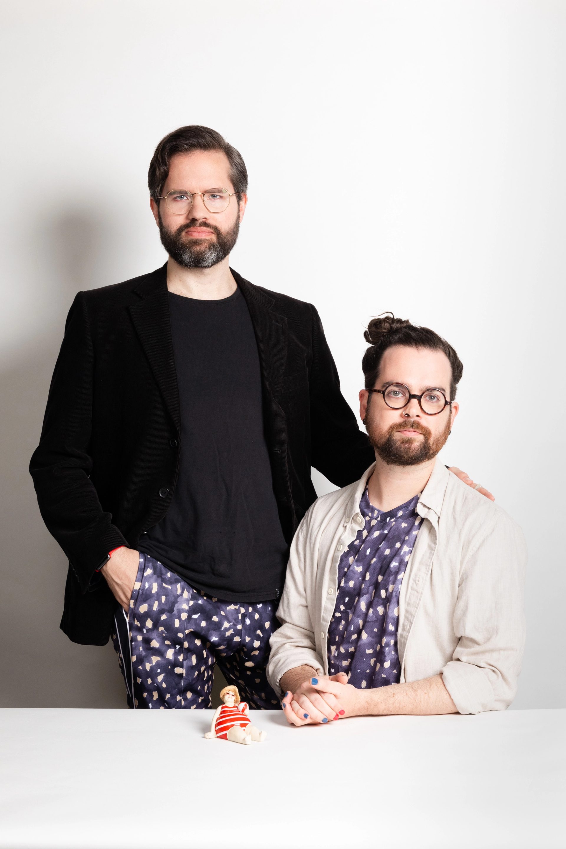 Two white men pose for a photo