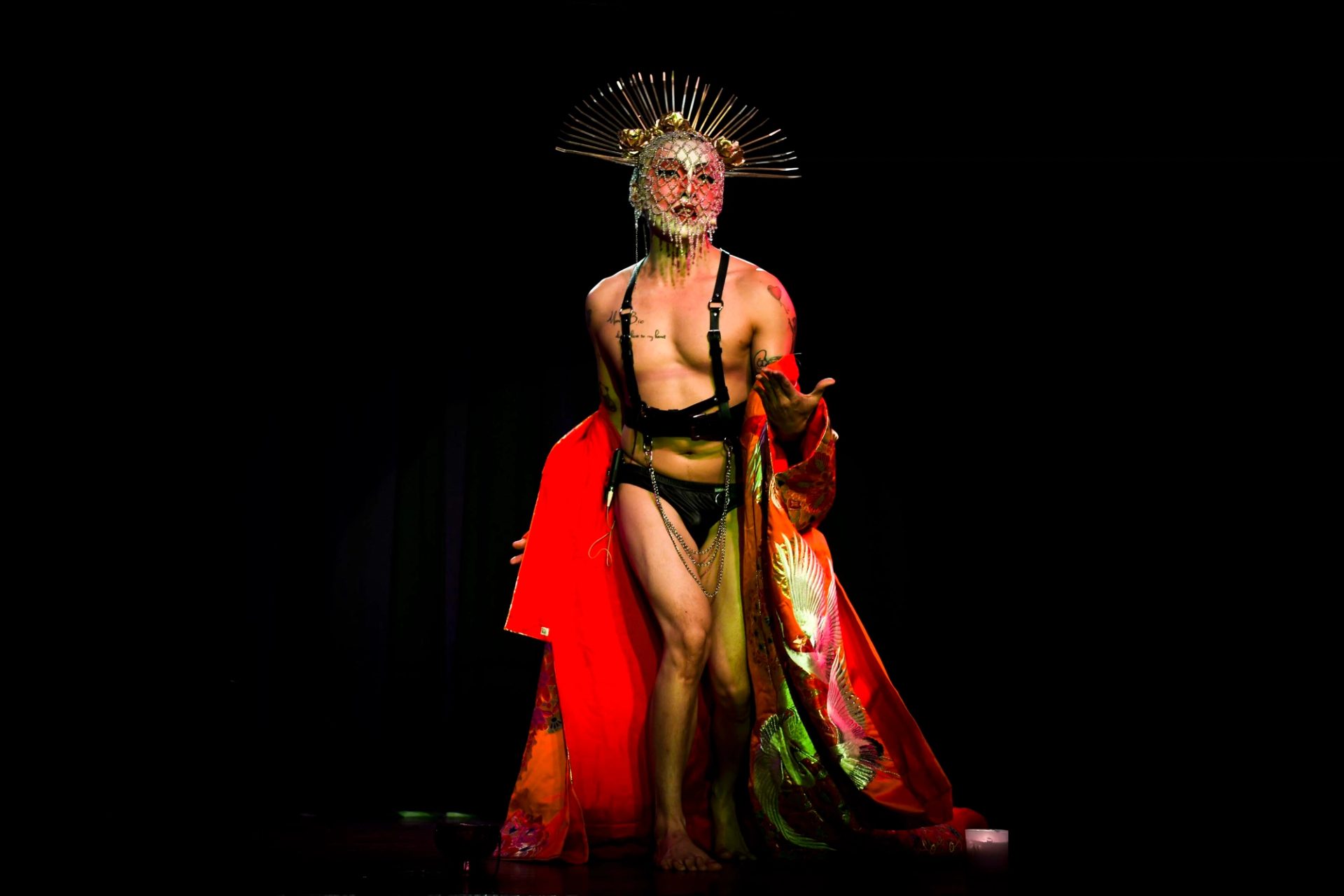 Performer on stage with dramatic pose