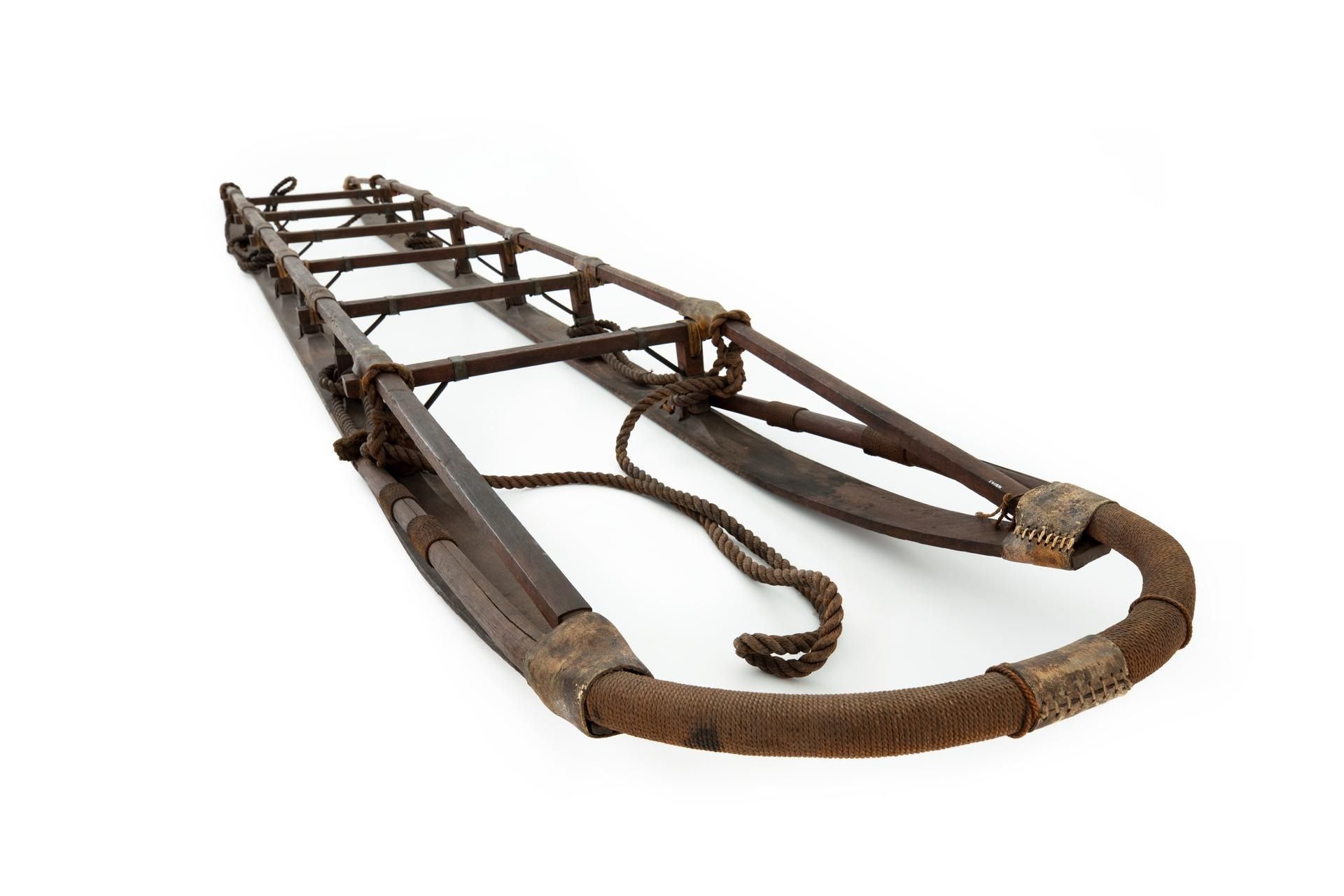 Wooden and leather sledge with rope tow strap