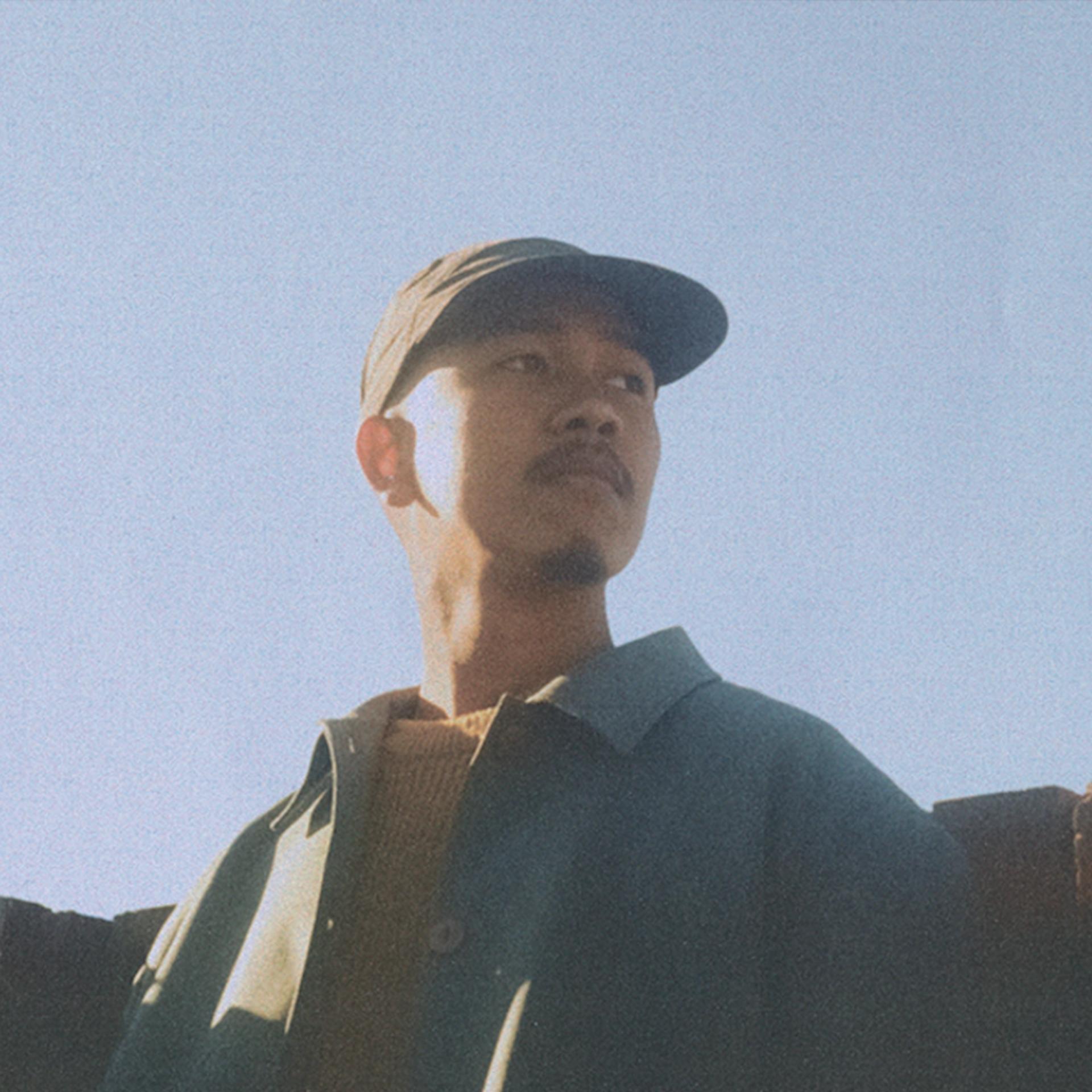 Portrait photo of man with blue sky in the background