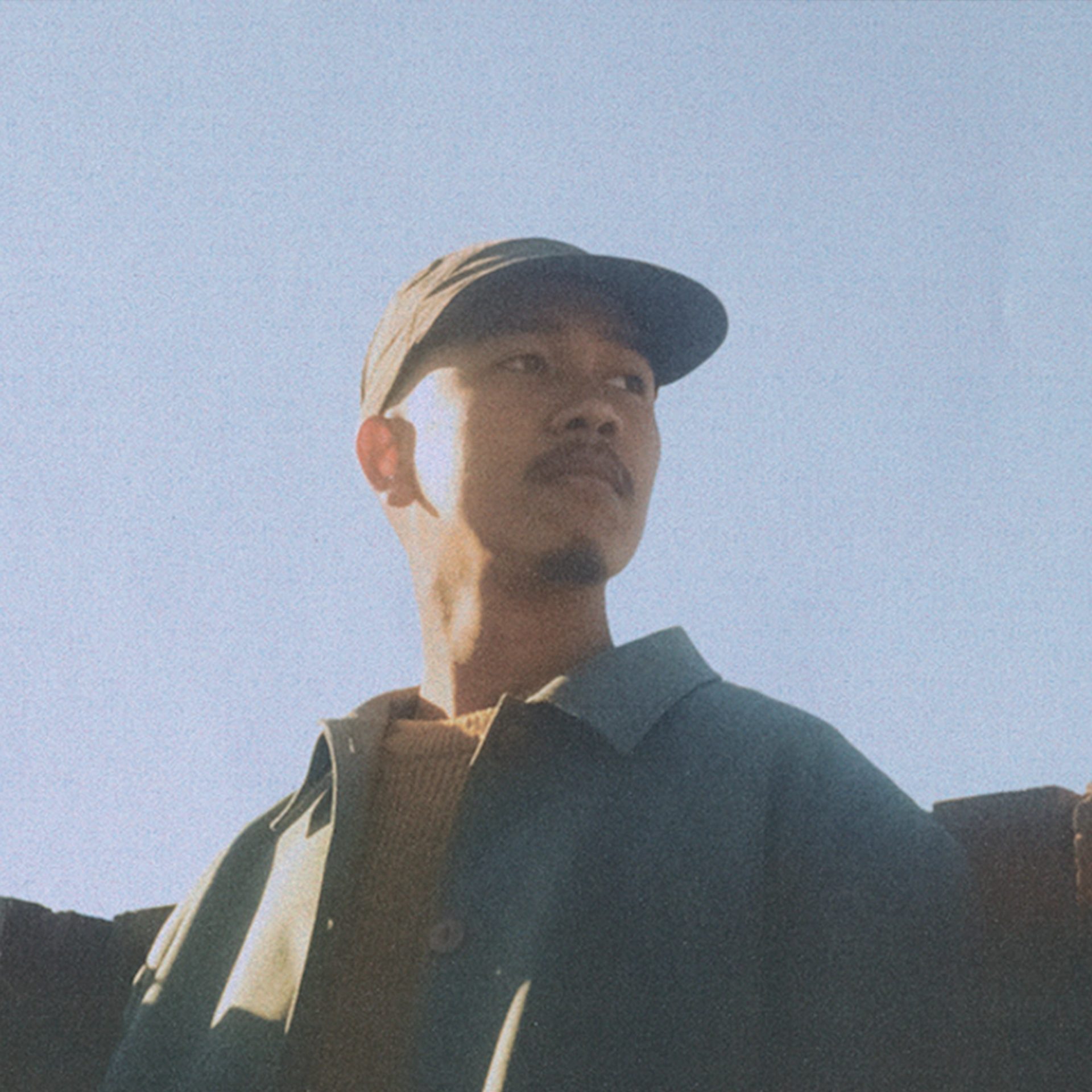 Portrait photo of man with blue sky in the background