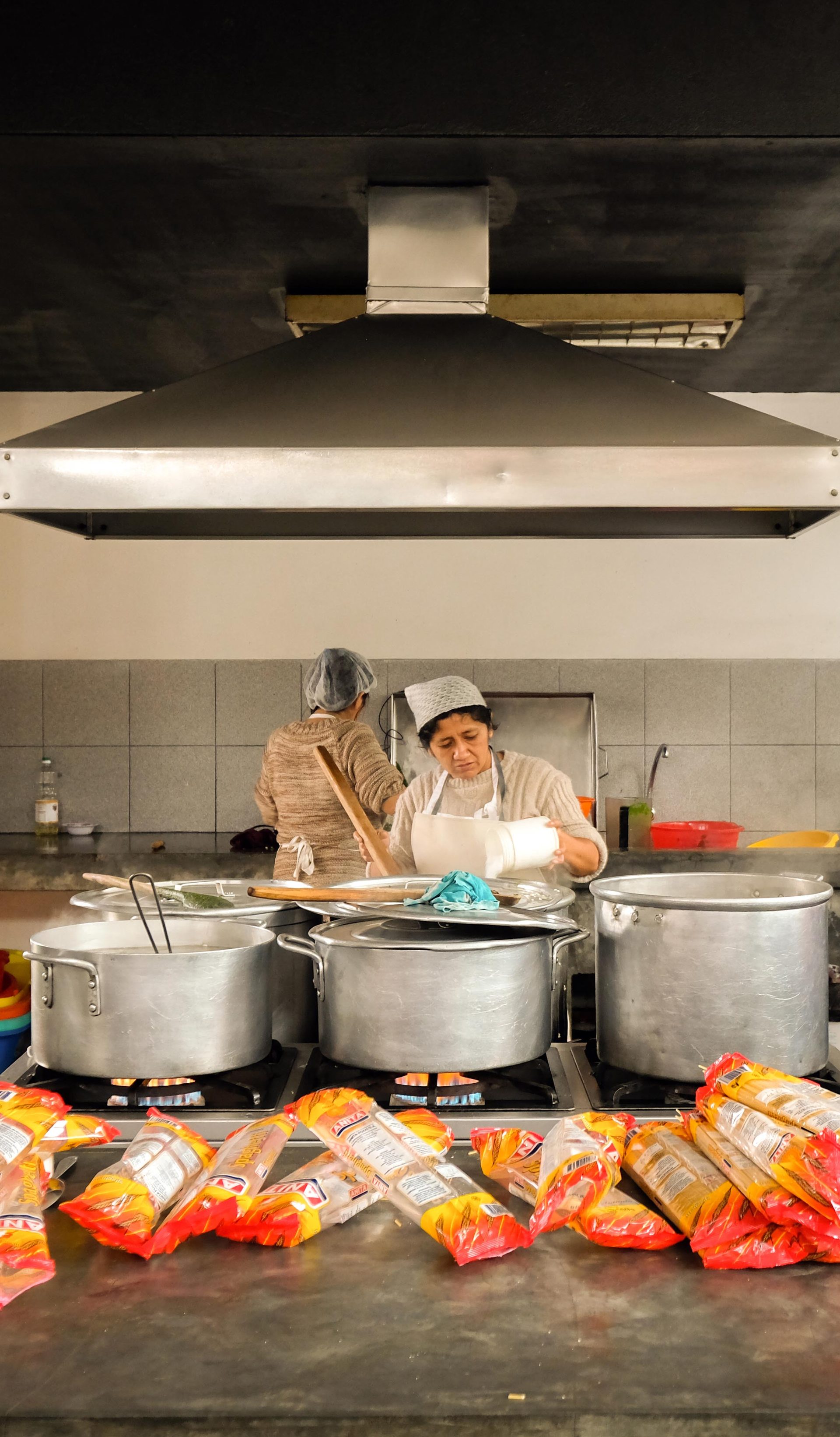 Women working in a kitchen.