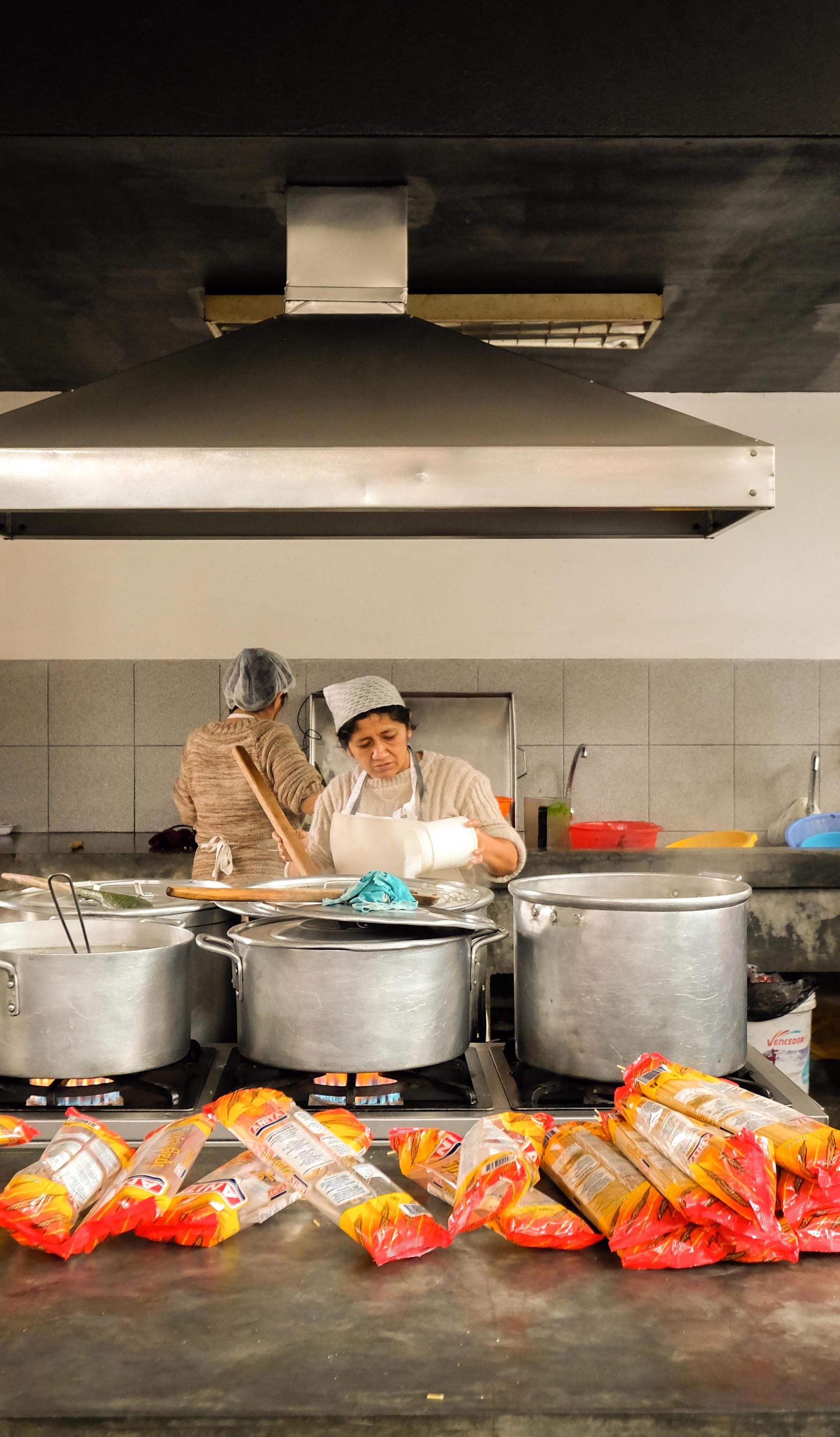 Women working in a kitchen.