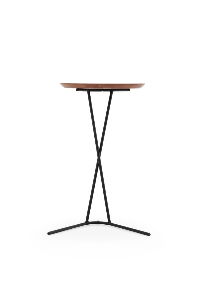 Side table with a timber table top and welded and bent black steel legs.