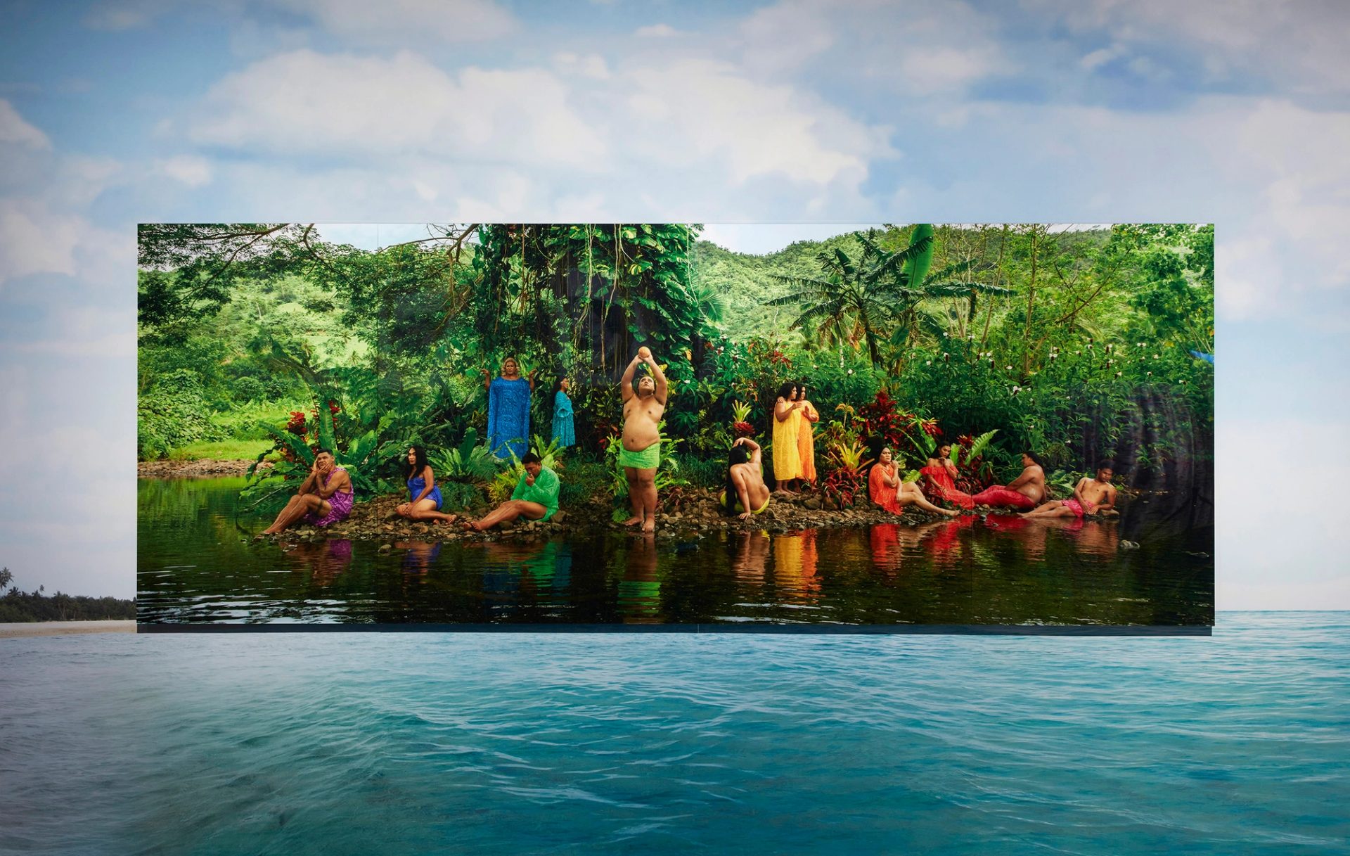 People posing on the rocky bank of an island river.