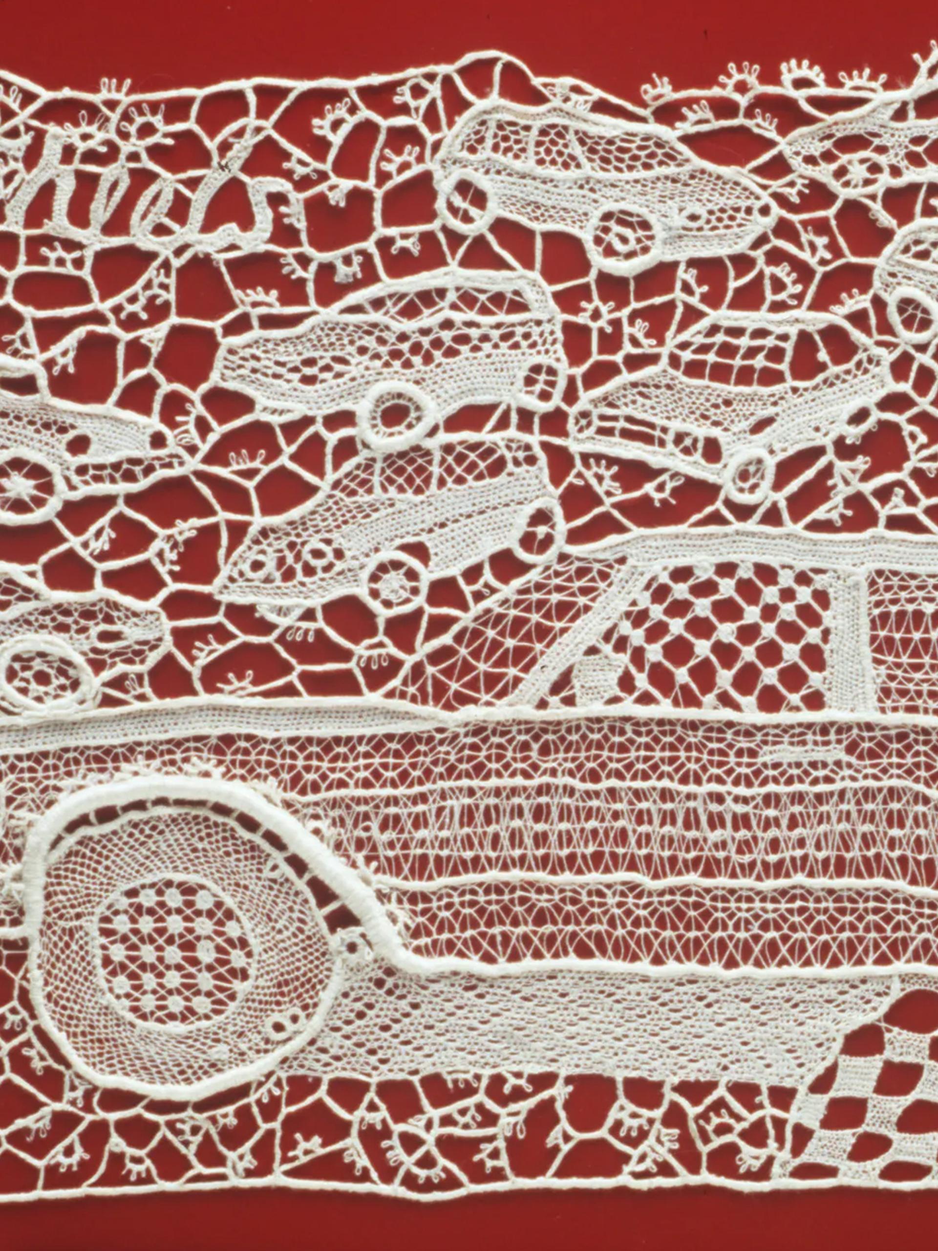 Rectangular lace panel, in 120 ecru linen thread, depicting a profile of a large car in the foreground with a number of small cars in the 3/4 profile randomly scattered in the background. All worked in many different needle-lace stitch patterns. Mounted with nylon thread onto red painted sheet of metal referencing a car door.
