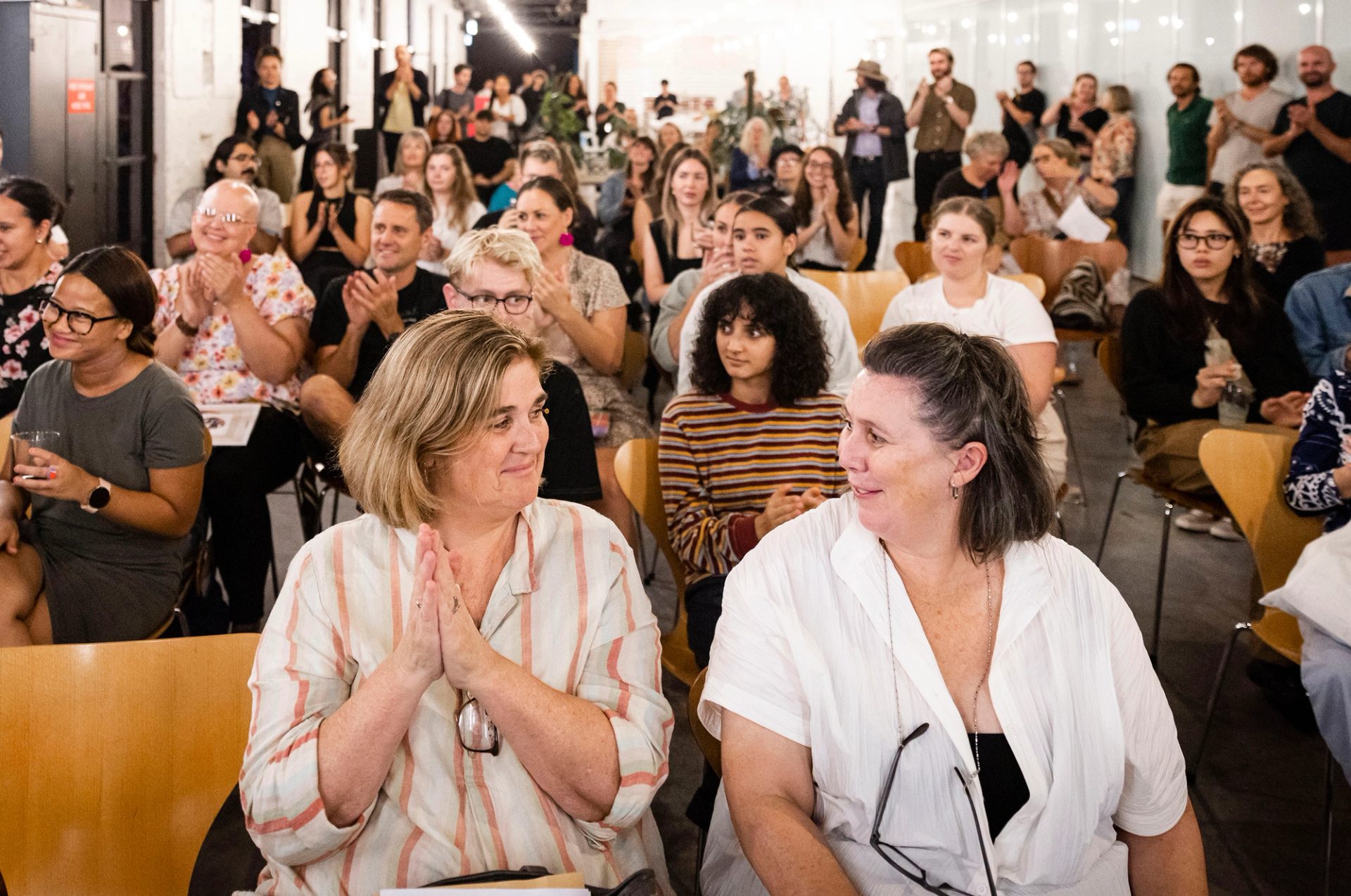 Group of people sitting on chairs