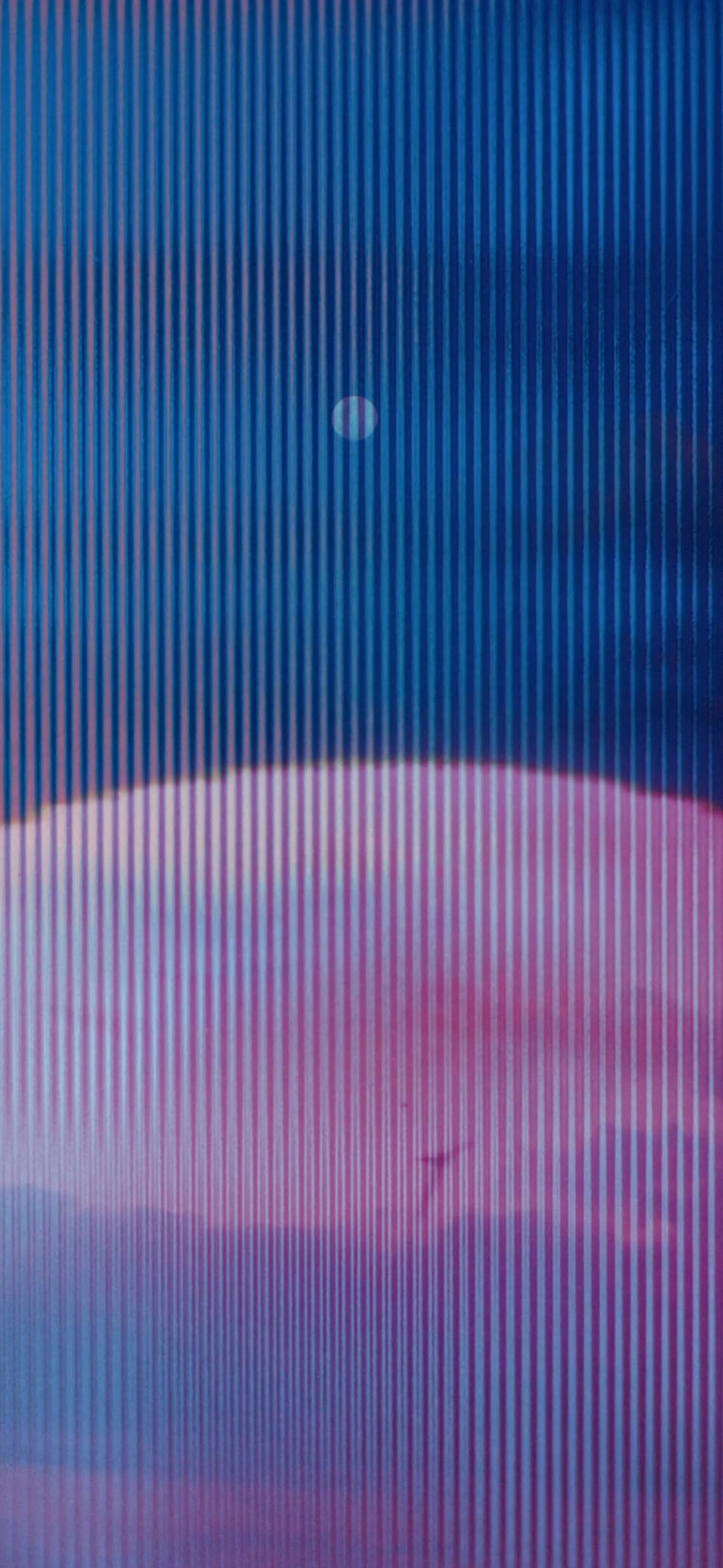 Moon and faces hovering behind it.