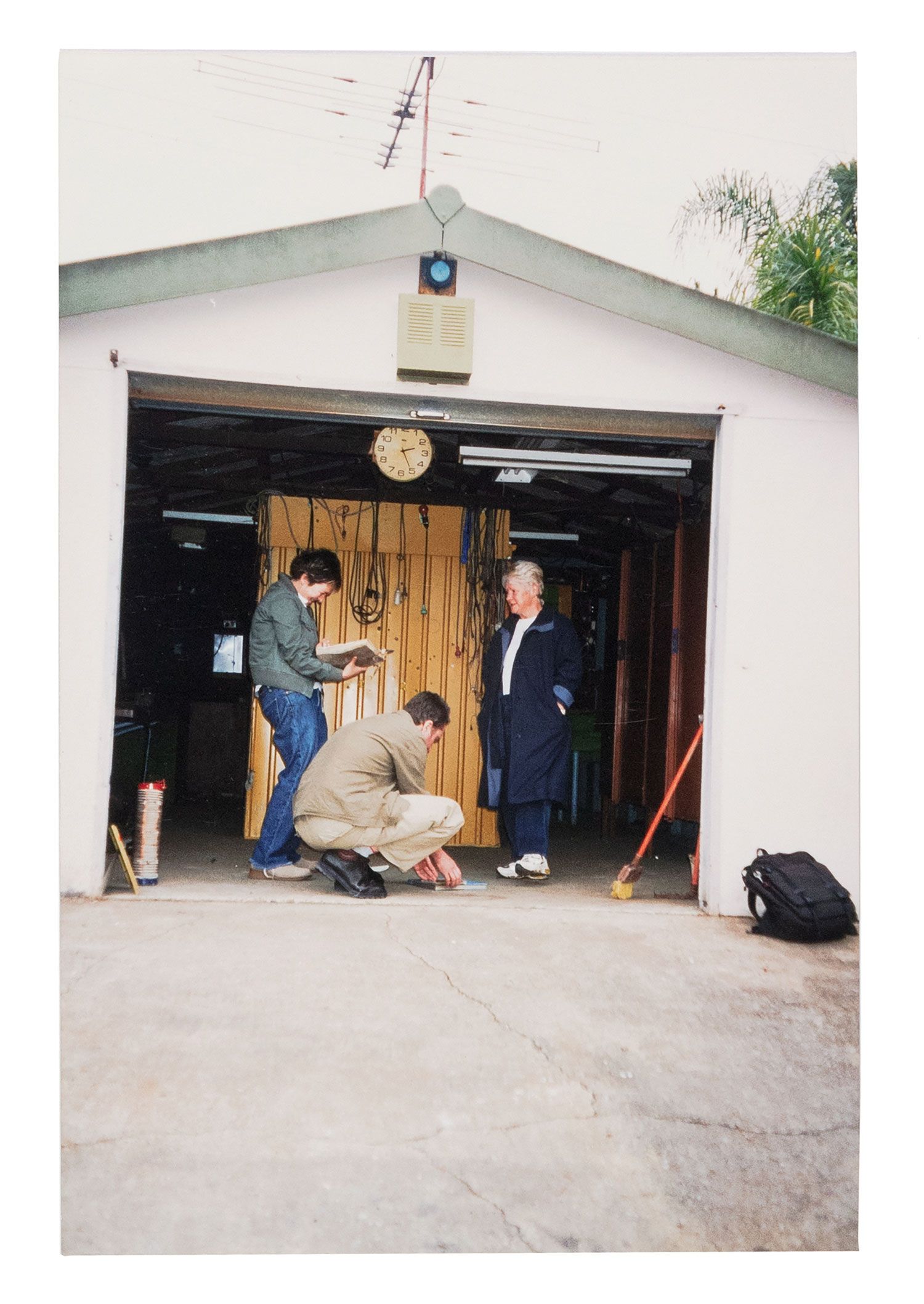 Green and yellow metal 'garden' shed containing elaborate electronic systems built into the interior. Inside the shed is a compartment which contains a seat where the user can sit and be suffused with radio waves produced by the electronic system.