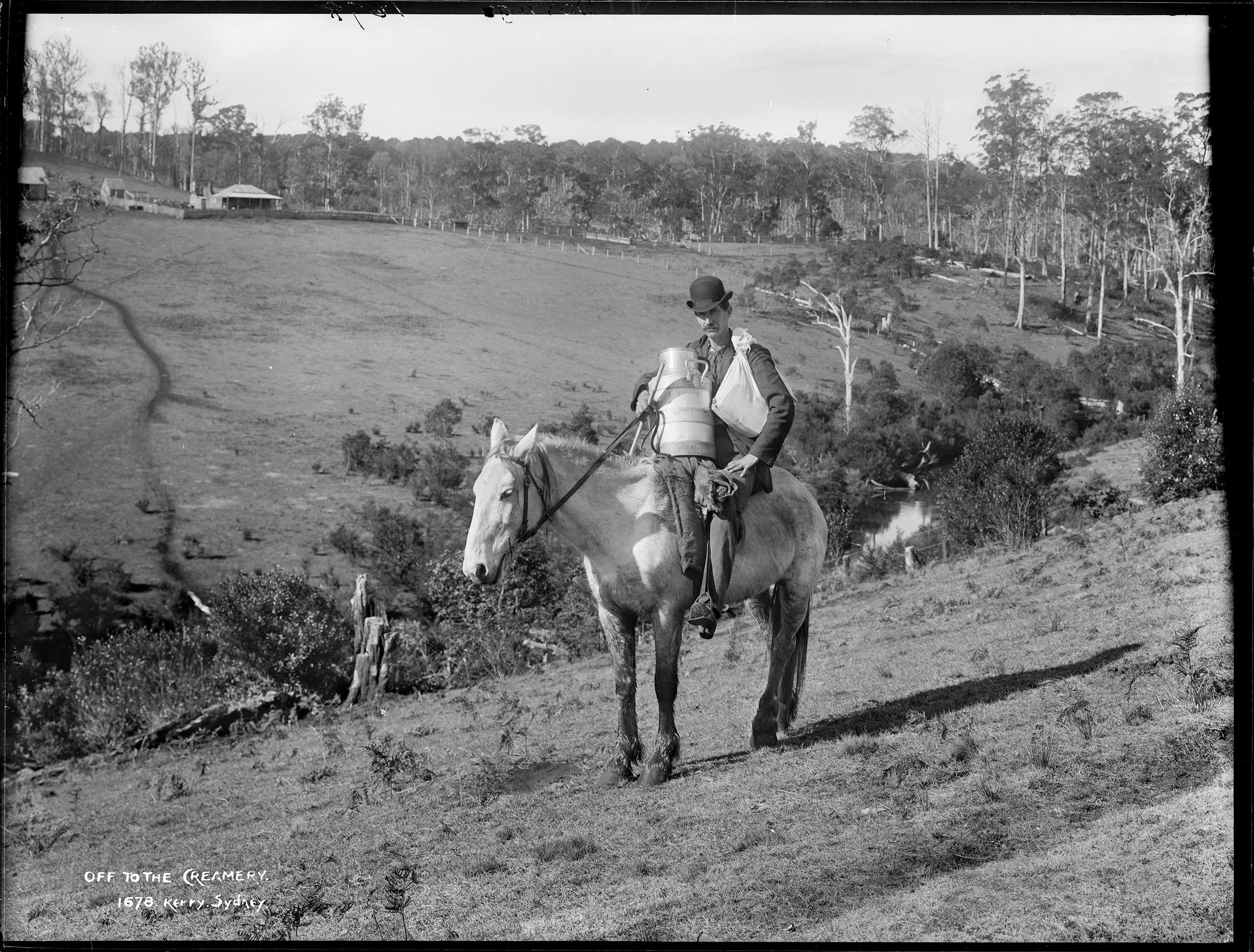 A man on horseback carrying a can of milk.