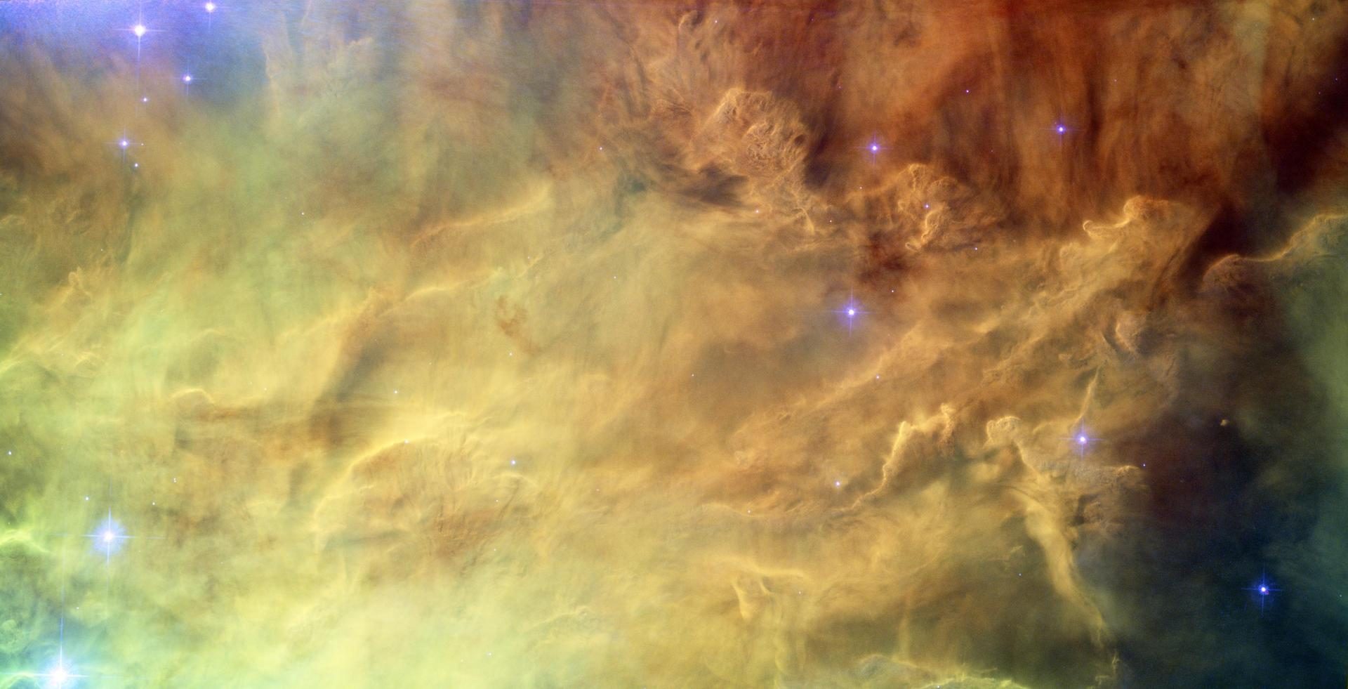 The Lagoon Nebula in space. Glowing dust and gas in colour.