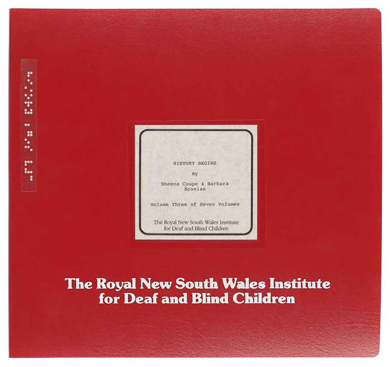 Red braille book with title ‘History Begins’ by The Royal New South Wales Institute for Deaf and Blind Children – both written in white text.