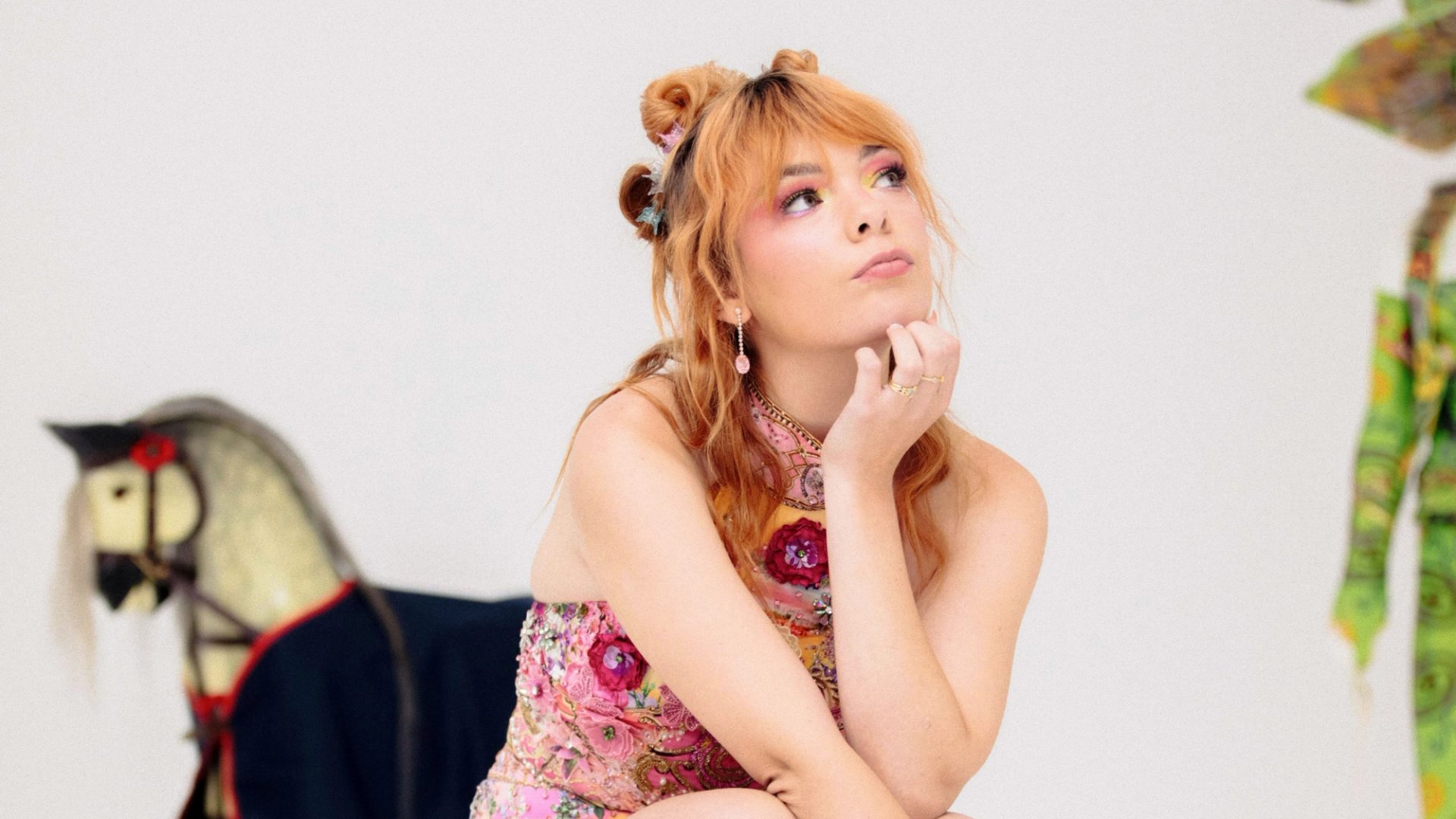 Activist Chloe Hayden posed against a white background and eclectic Powerhouse Collection objects.