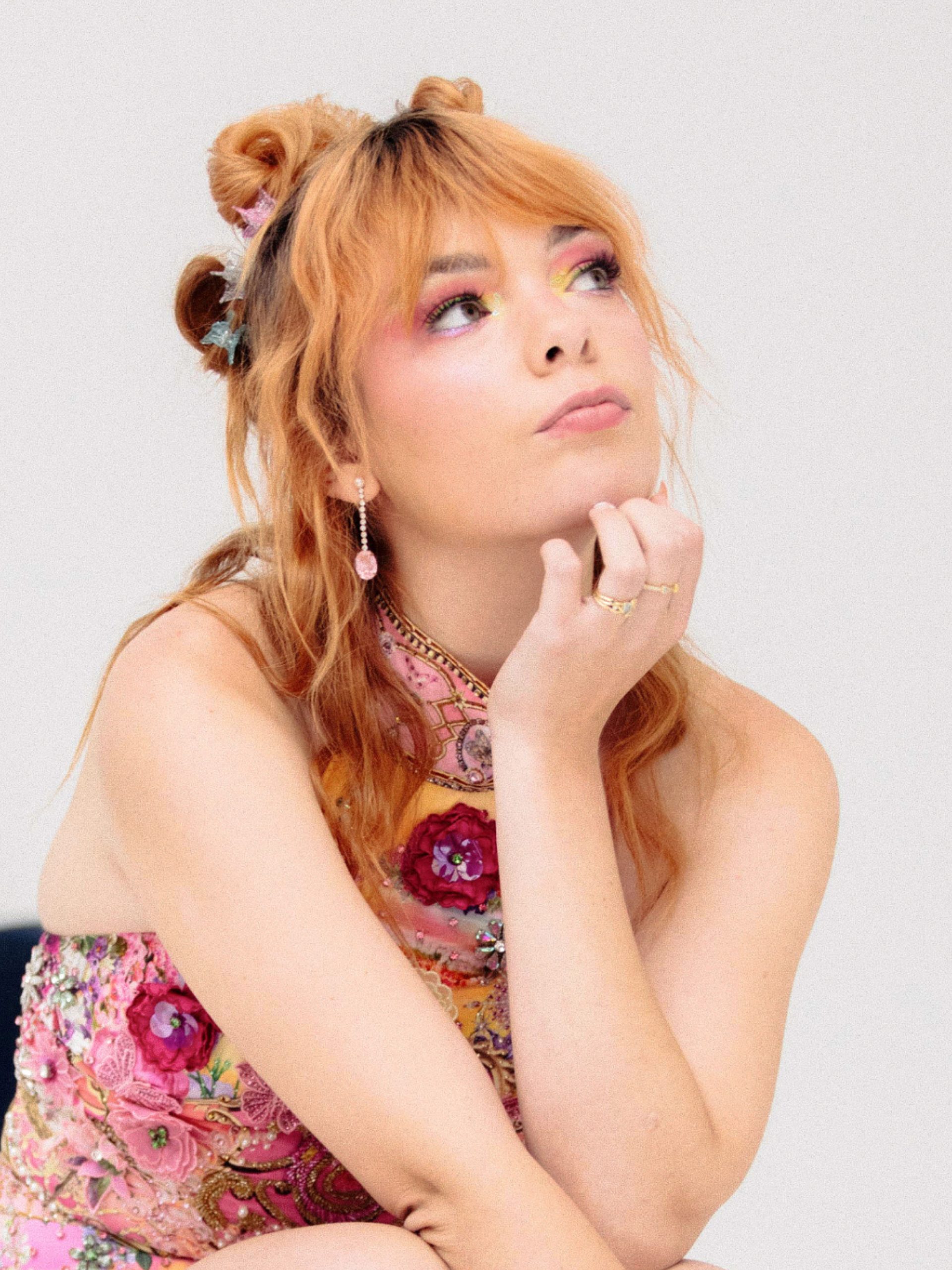 Activist Chloe Hayden posed against a white background and eclectic Powerhouse Collection objects.