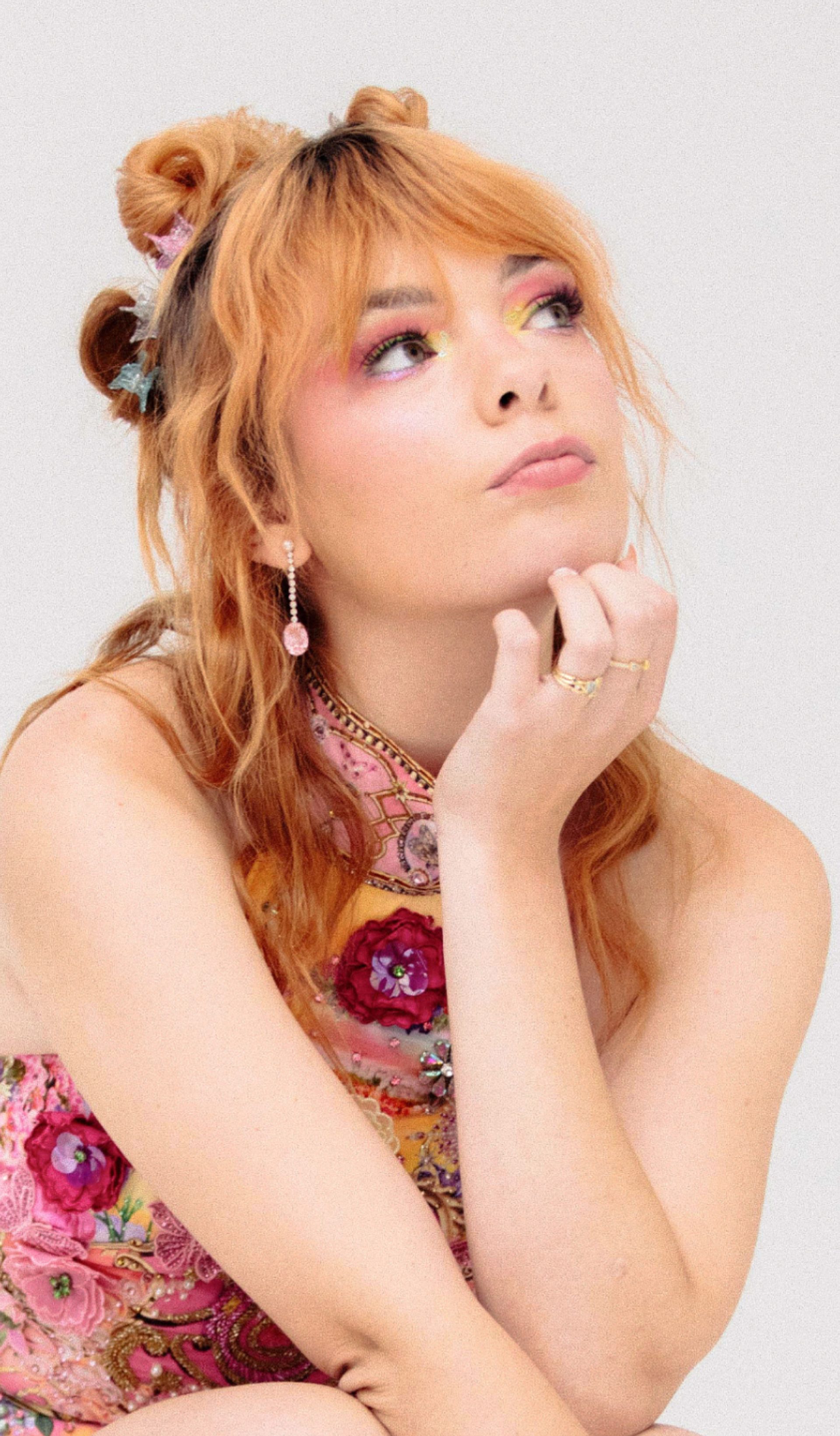 Activist Chloe Hayden posed against a white background and eclectic Powerhouse Collection objects.