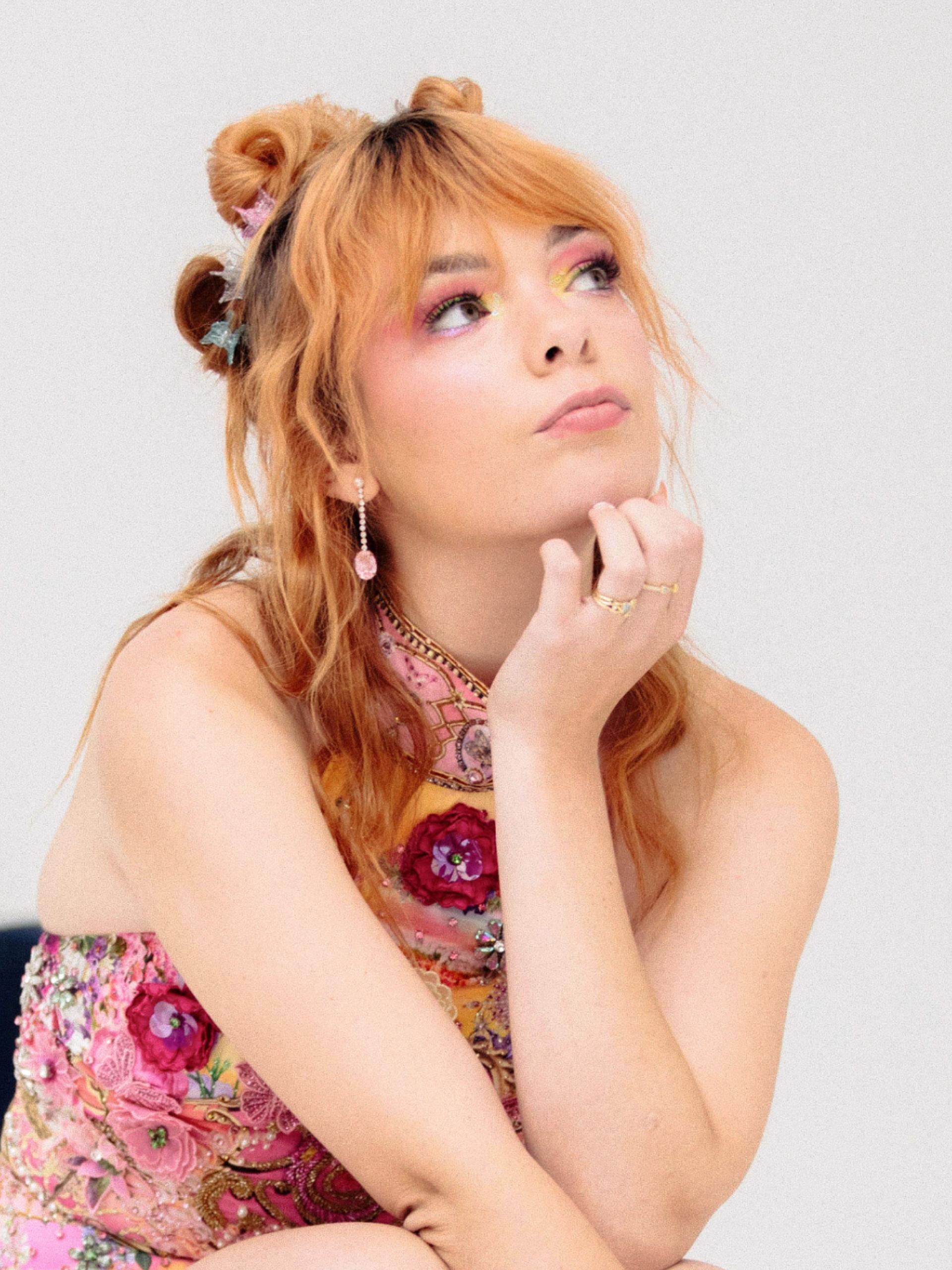 Activist Chloe Hayden posed against a white background and eclectic Powerhouse Collection objects.