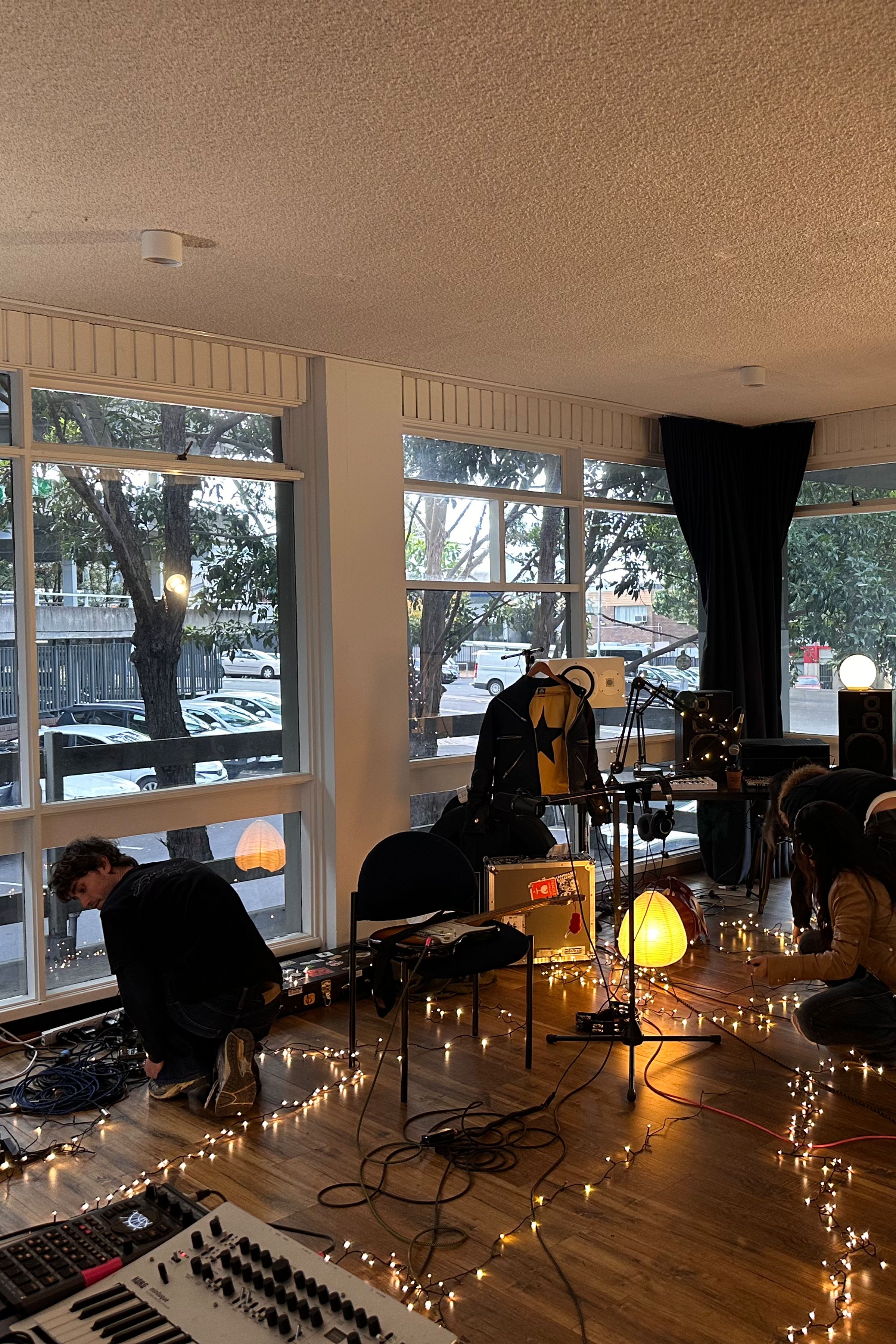 The studio musician FRIDAY* worked in during the Generations fellowship, festooned in fairy lights, with instruments dotted around the space