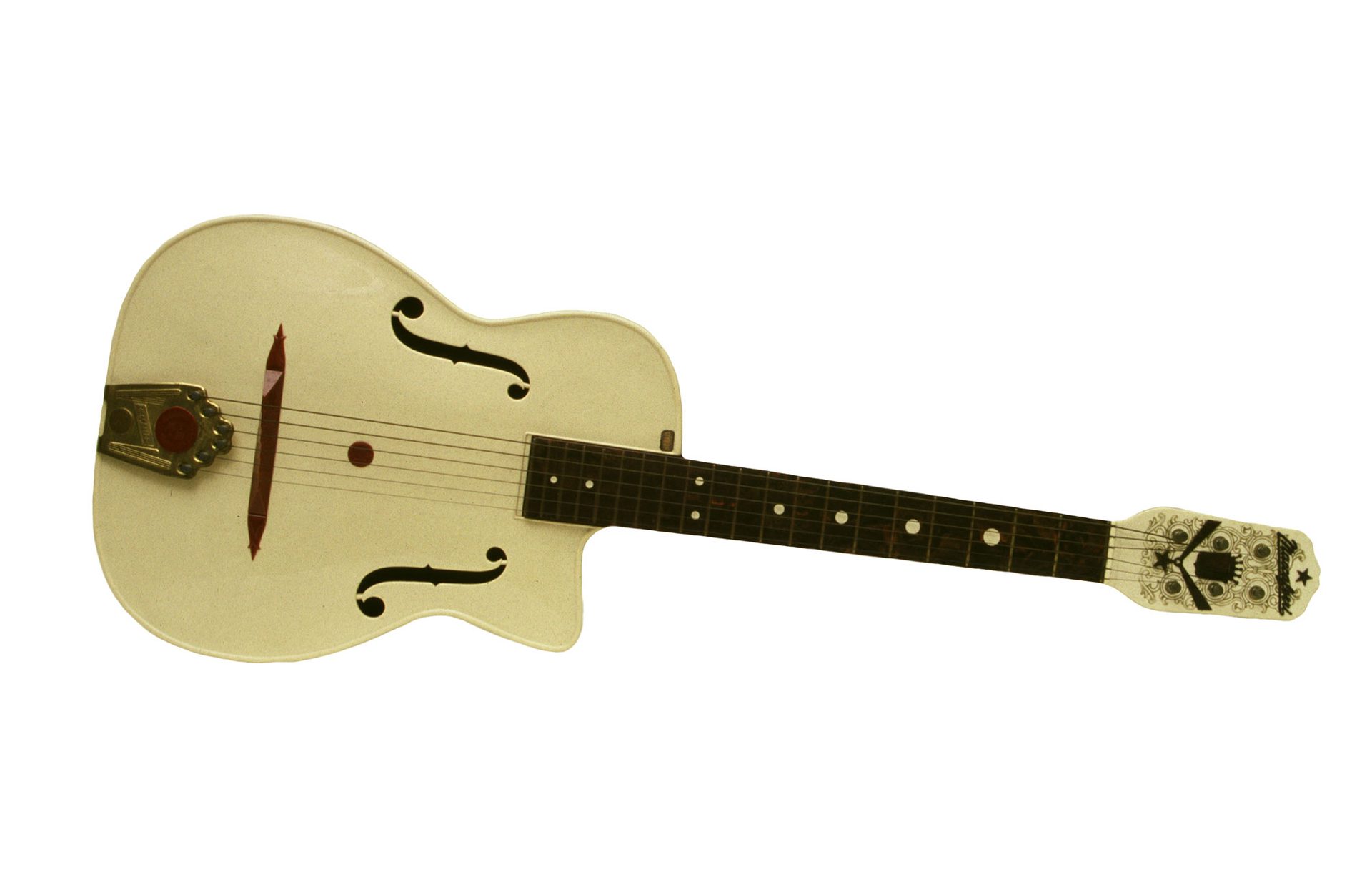 A pale yellow hollow body guitar lies on its side.