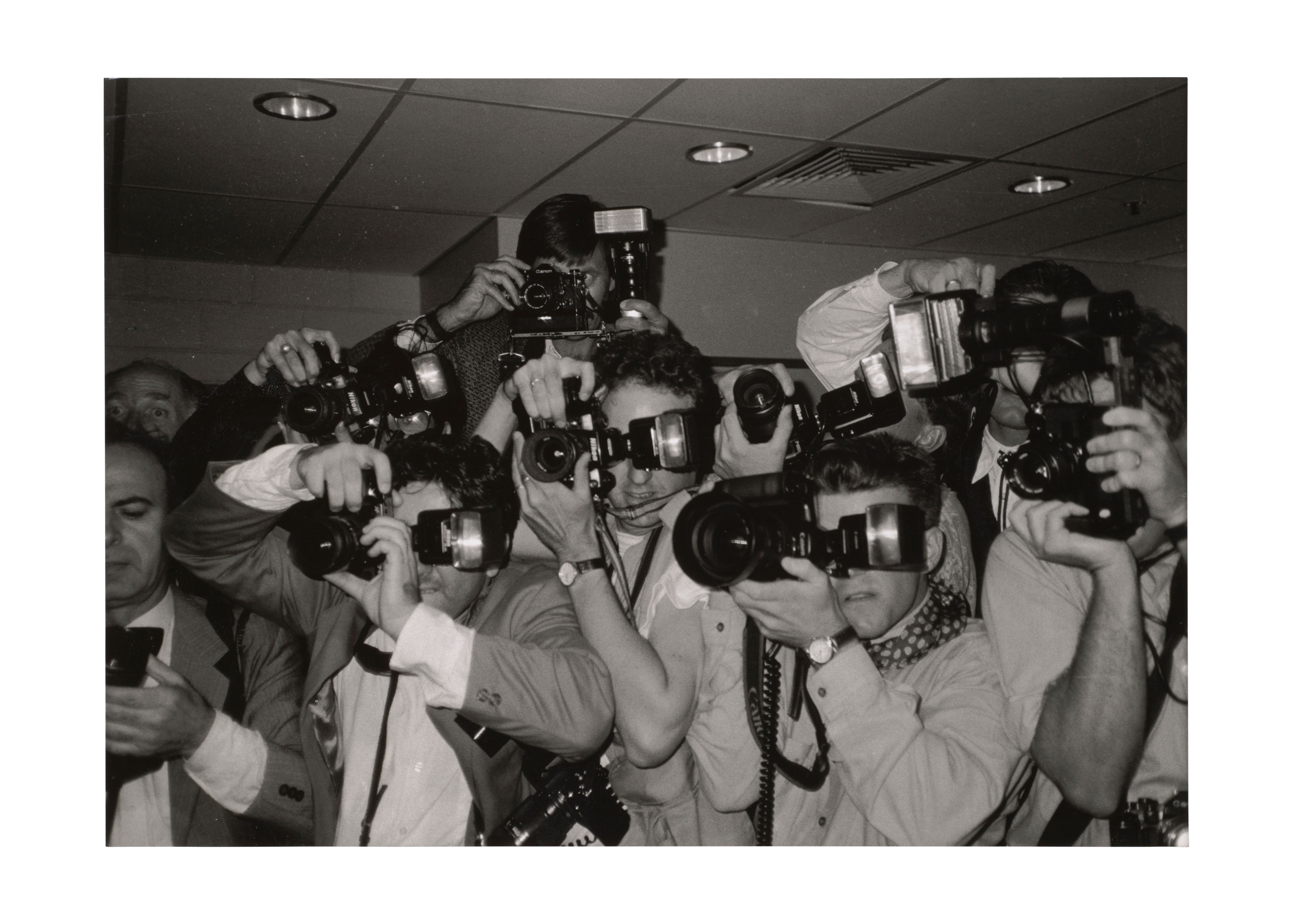 Black and white photograph of paparazzi