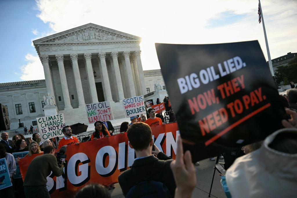 People protest in front of the US Supreme Court as the court considers the Suncor v. Boulder case in Washington, DC, on October 5, 2026.