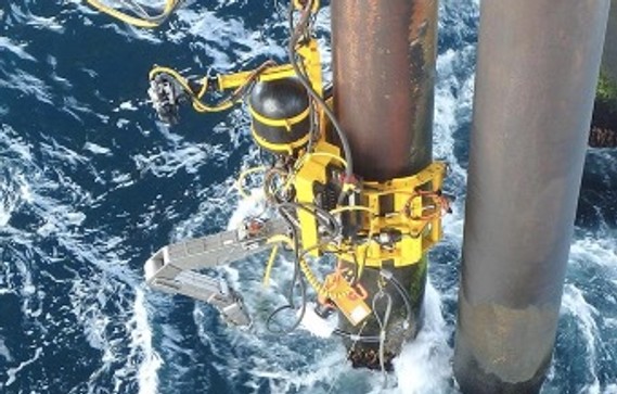A remotely controlled robot from cluster partner OceanTech cleaning the leg of an oil rig to enable further repair and modification. 