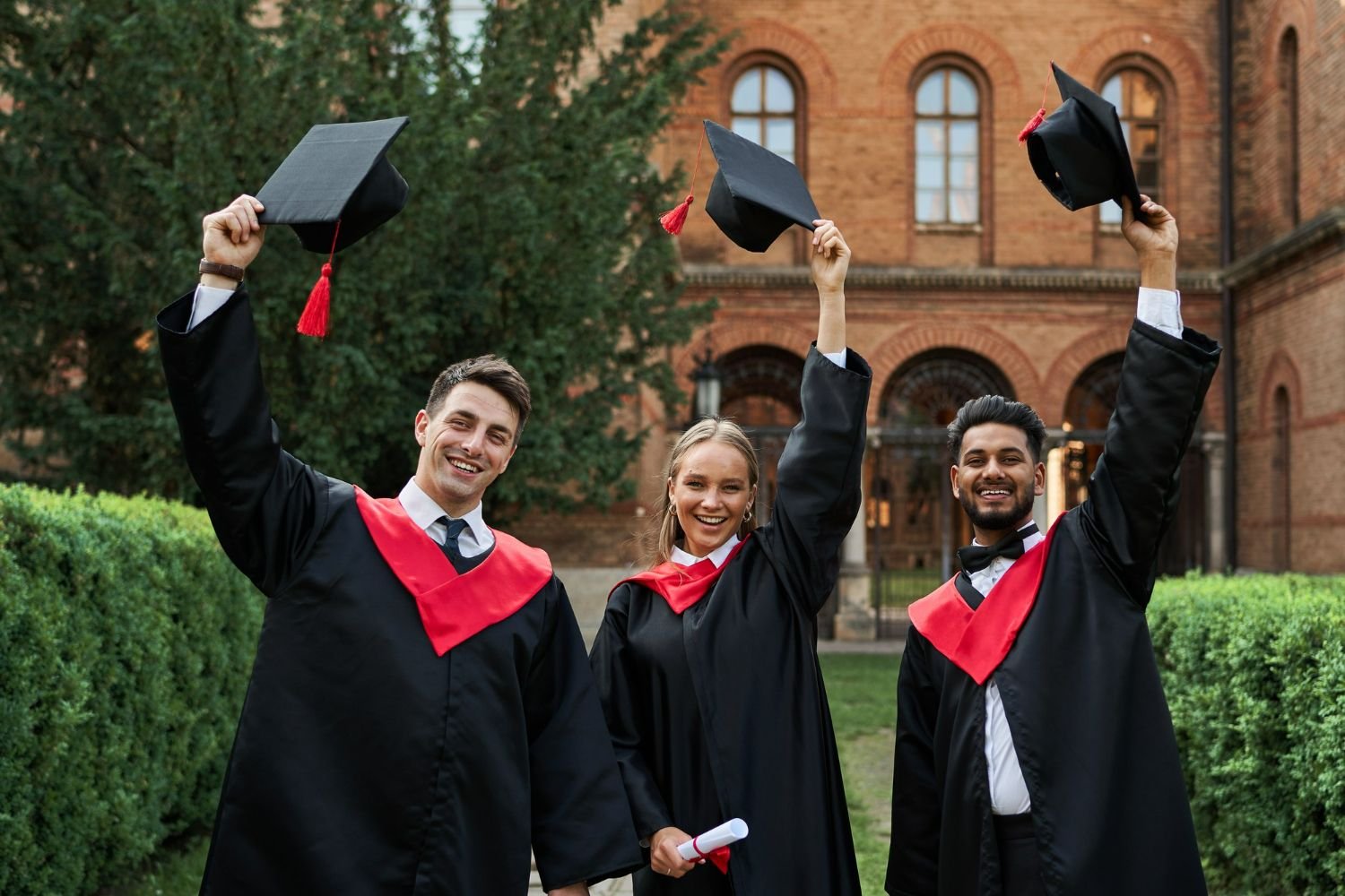 Students celebrating their university graduation (SAGE Education)